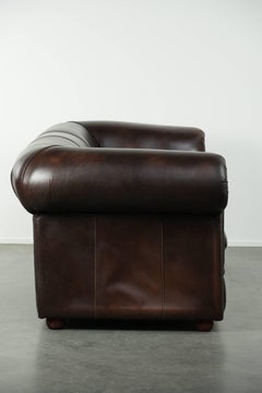 Luxury brown smooth cow leather Chesterfield sofa with an English look