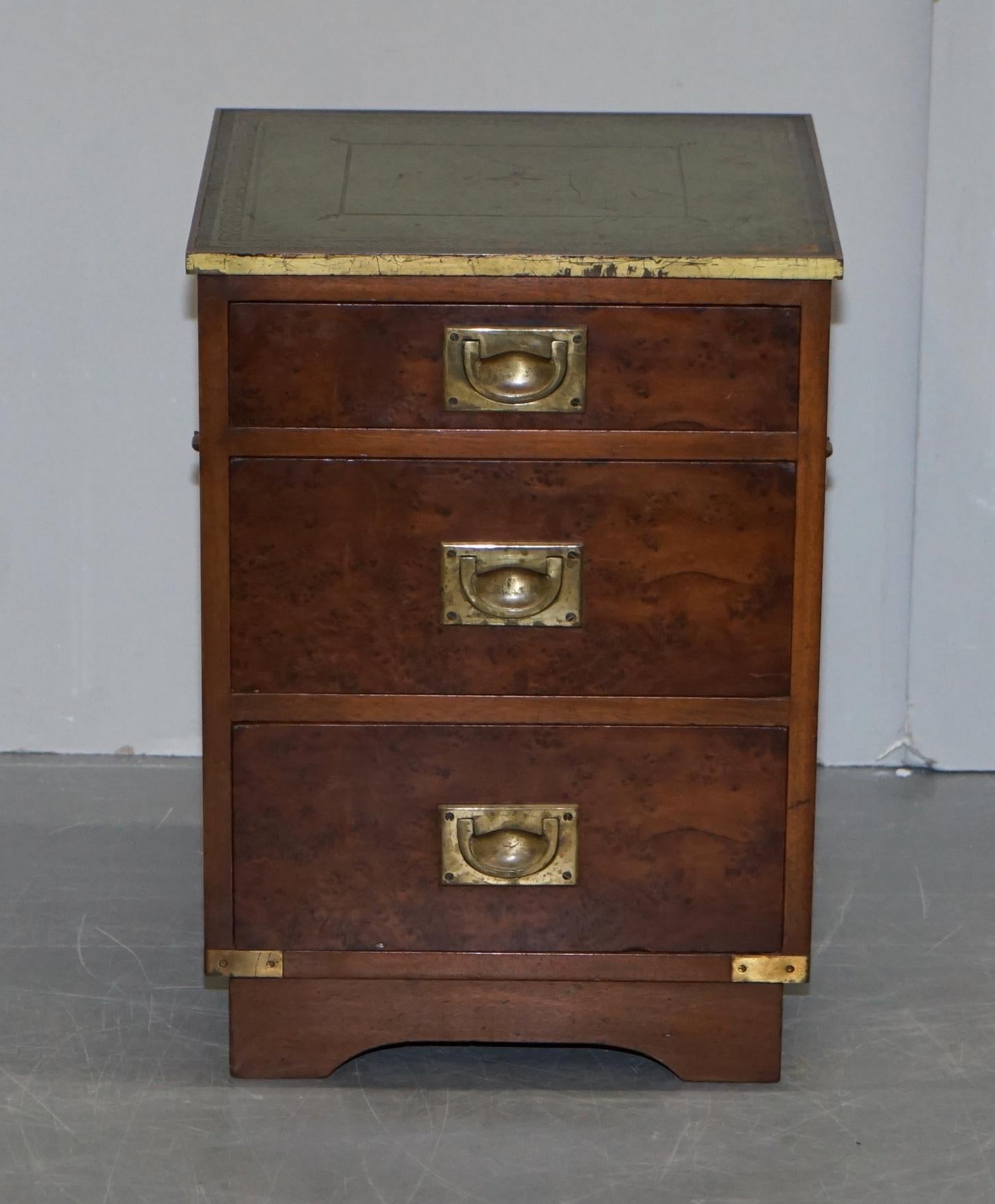 We are delighted to this luxury Vintage burr walnut, gold leaf embossed green leather top with brass trim Military Campaign bedside lamp or wine table drawers 

This is a very luxurious piece, the frame is solid hardwood with a burr and burl walnut