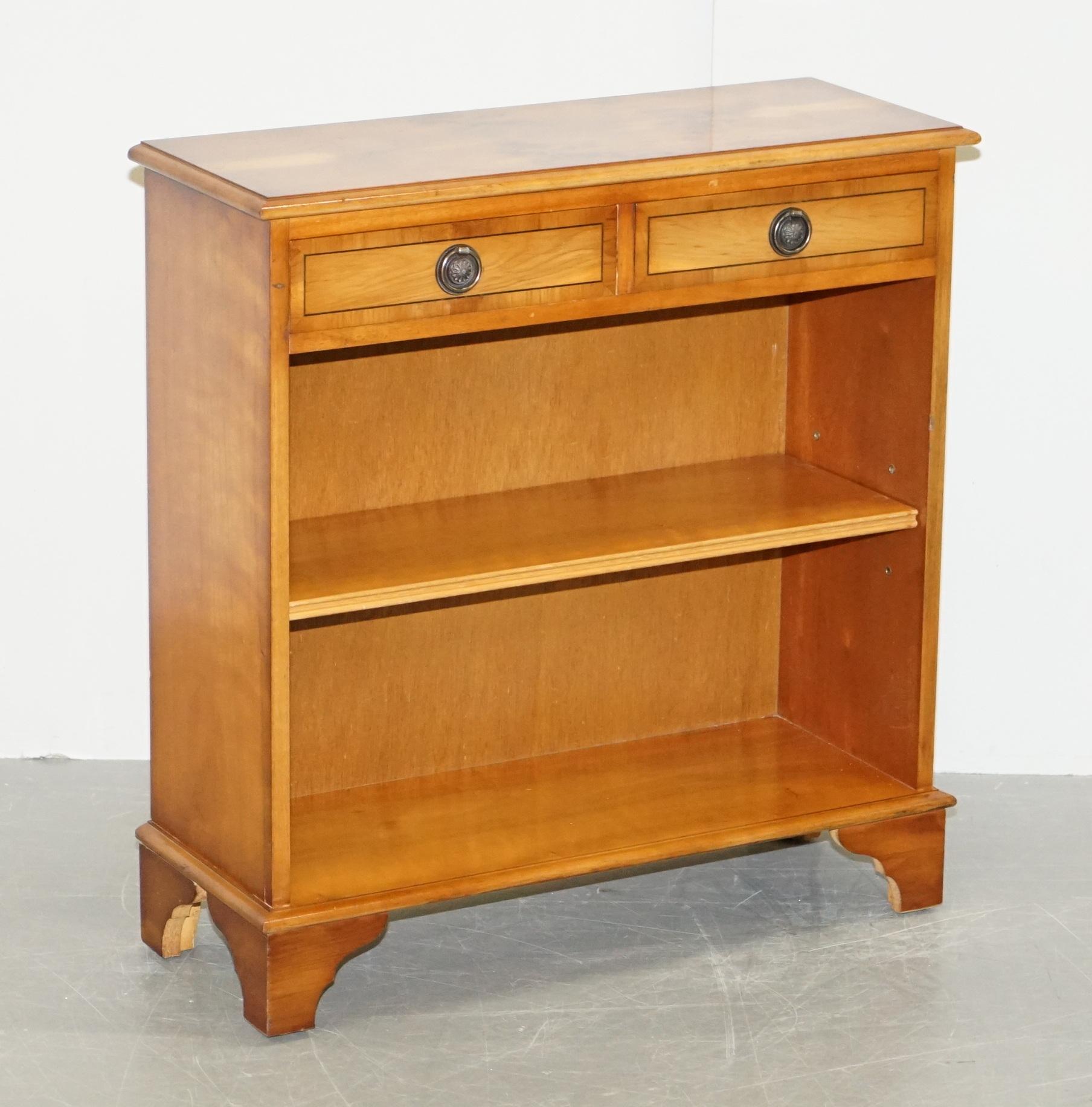 We are delighted to this lovely handmade in England vintage Burr Yew wood open library bookcase with twin drawers

This piece is in sublime condition, the shelf is height adjustable, the drawers run smoothly. The frame is a mixed hardwood frame