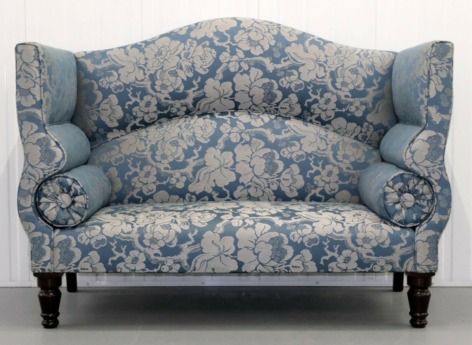 We are delighted to offer for sale this Luxury and well known makers George Smith Ryan soft blue/silver two seater sofa on solid wood legs.

With its high and stylish camel back, this sofa offers you the perfect nook to curl up with a book on a