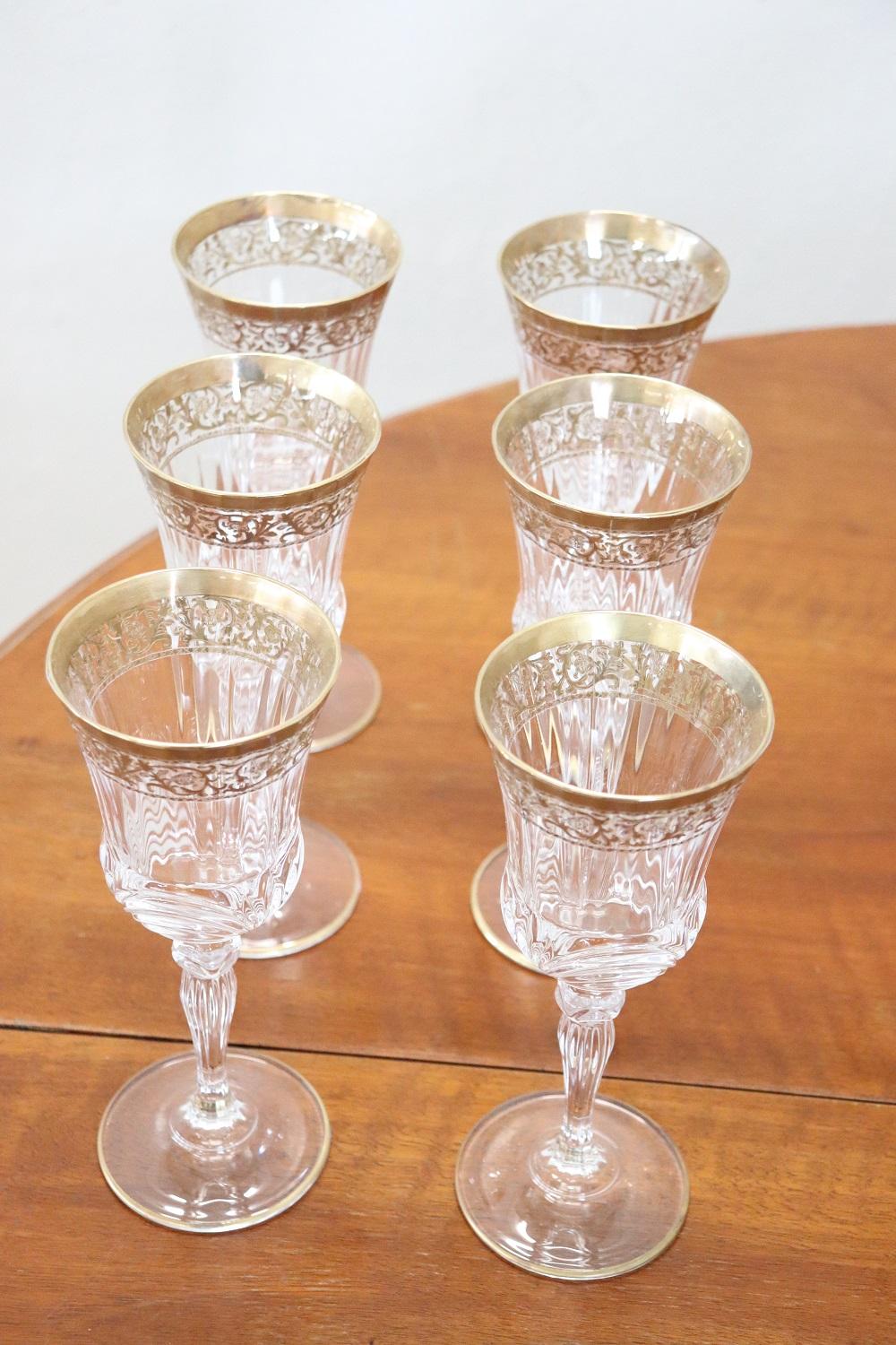 Beautiful and refined Italian crystal service complete for six people at the table. Elegant gold decoration.
Crystals glasses set with total 24 glasses and 1 water jug.
Perfect conditions, 1930s.

 