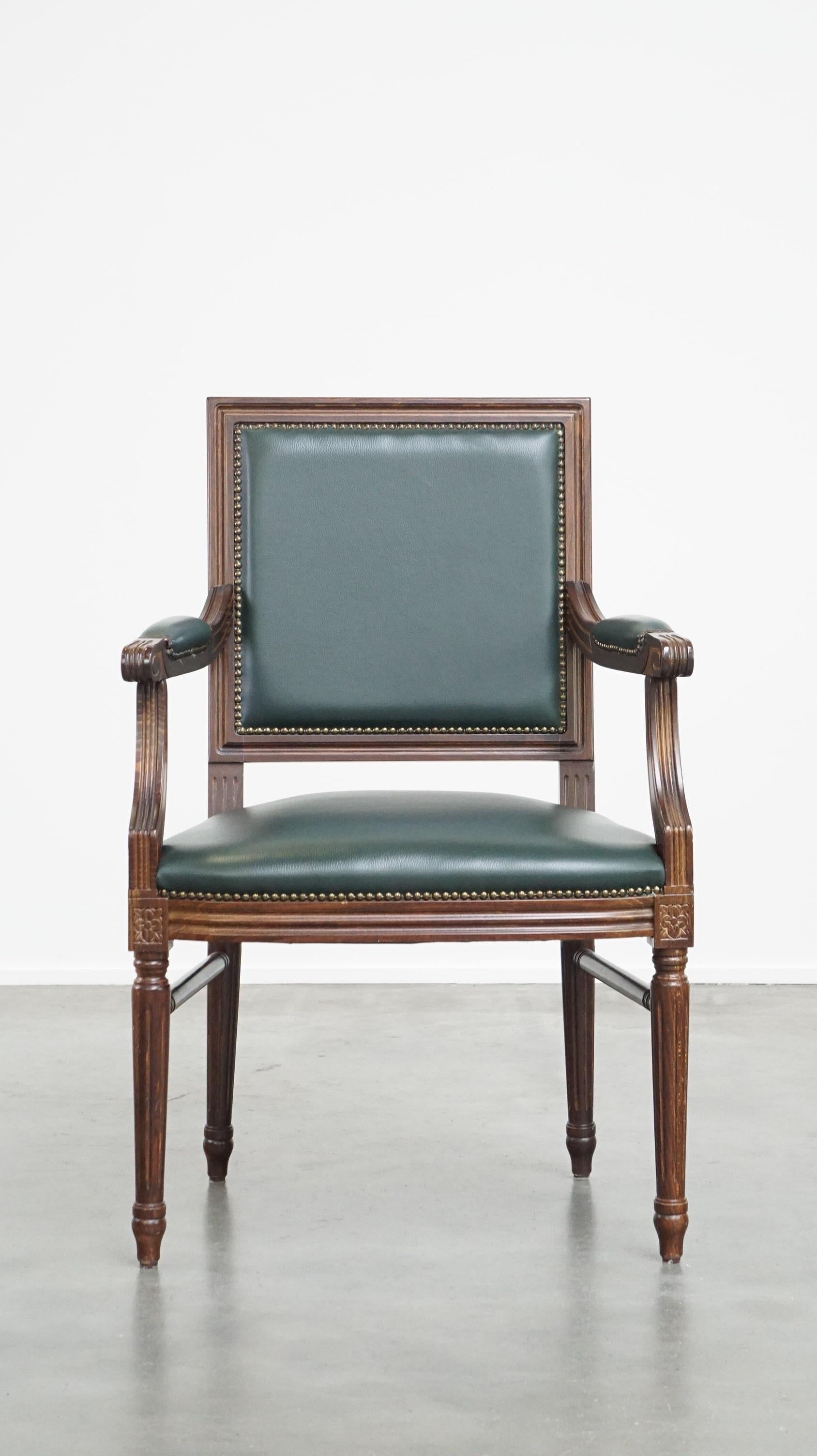 This amazing chair has a fantastic color and can easily fit into both classic and modern interiors or office spaces. It has a wooden frame with a cowhide leather seat and backrest. The chair features beautiful details in the wood, making it a real