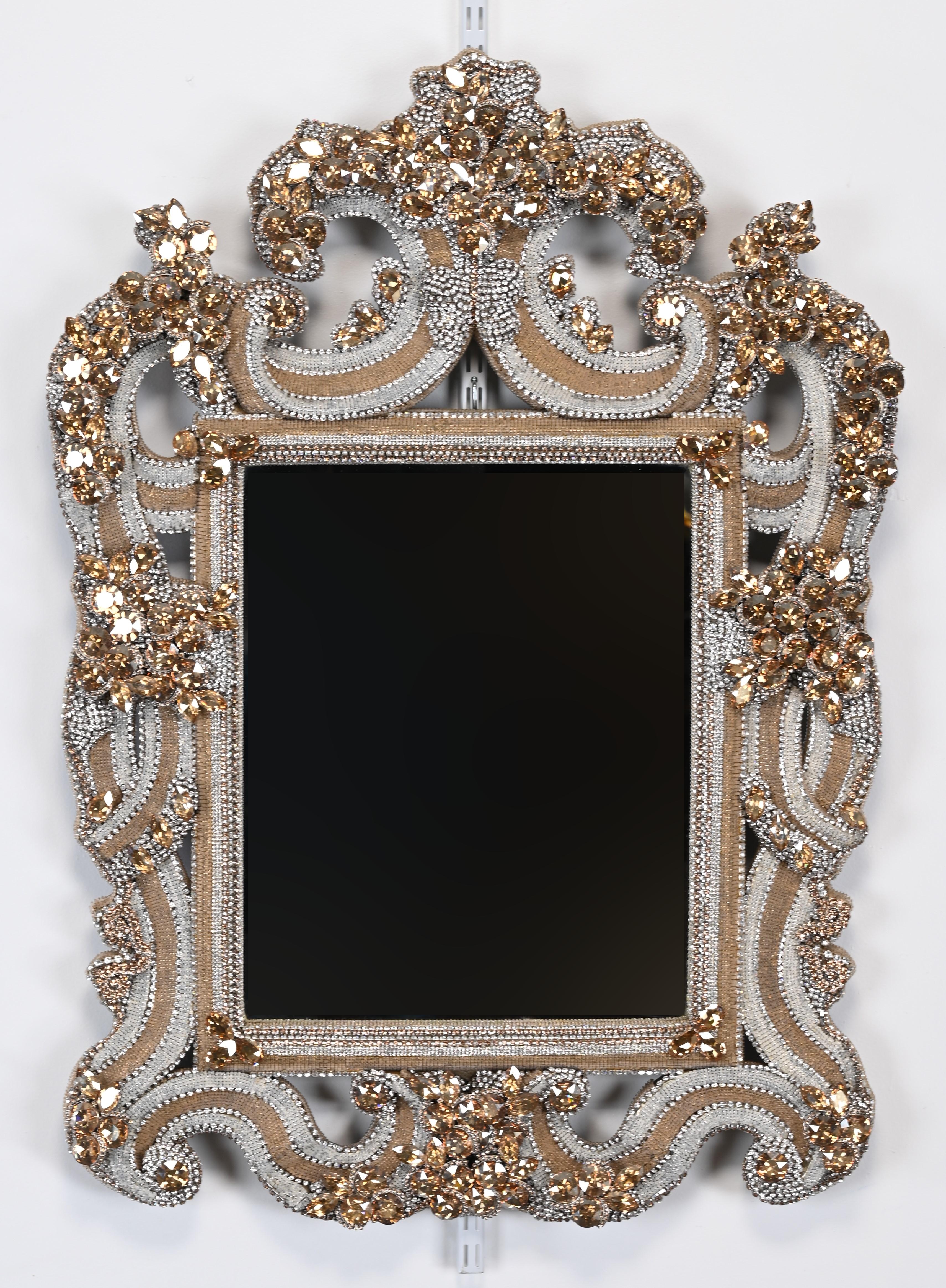 A fabulous Swarovski crystal jeweled mirror with beveled glass. From the B.B. Simon website as follows:

