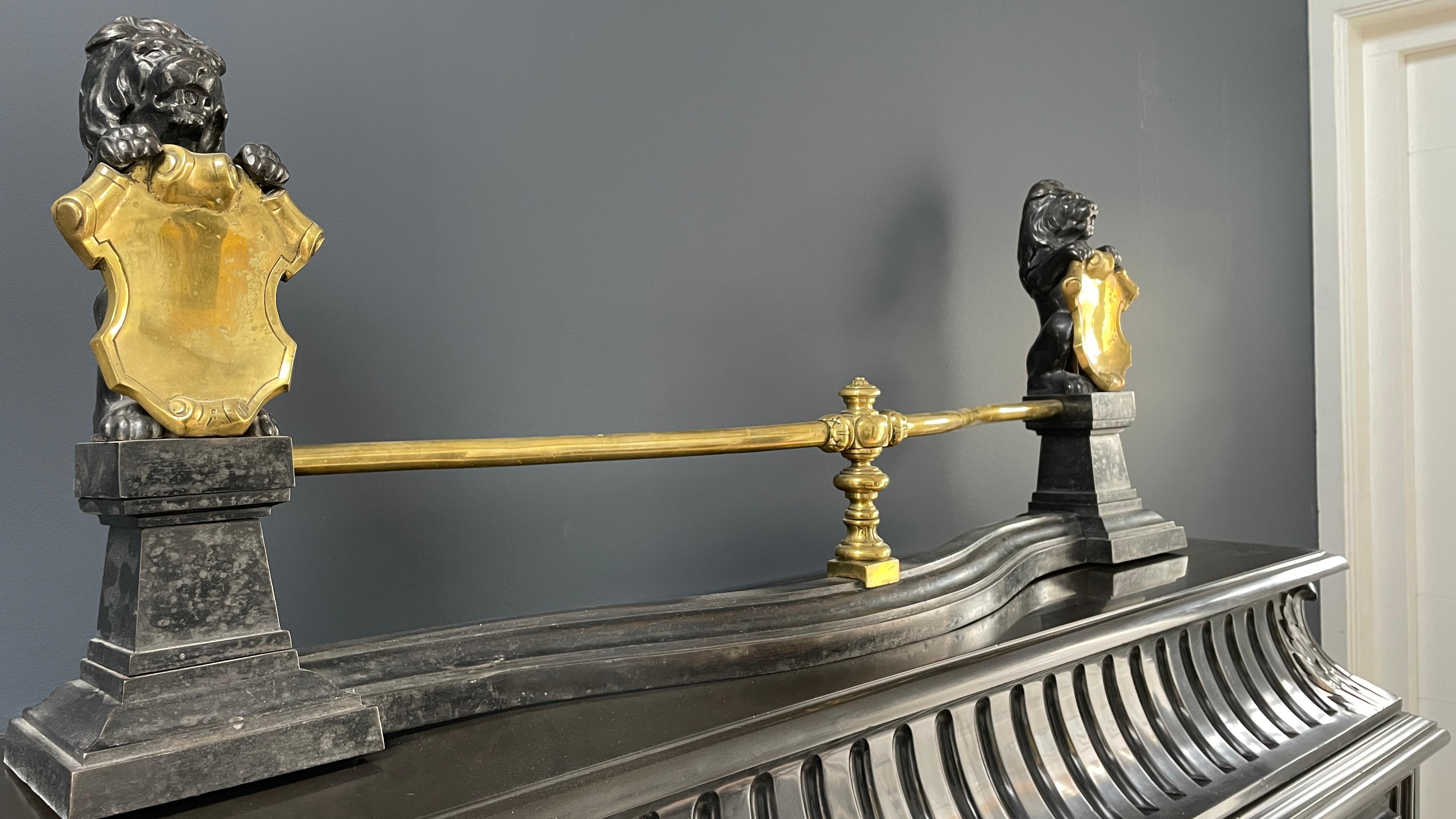 Beautiful antique French fender. The Fender is placed as a shield in front of the fireplace. This beautiful fender is in very good condition. The width and the combination of the black cast iron and shiny brass give a beautiful rich appearance.