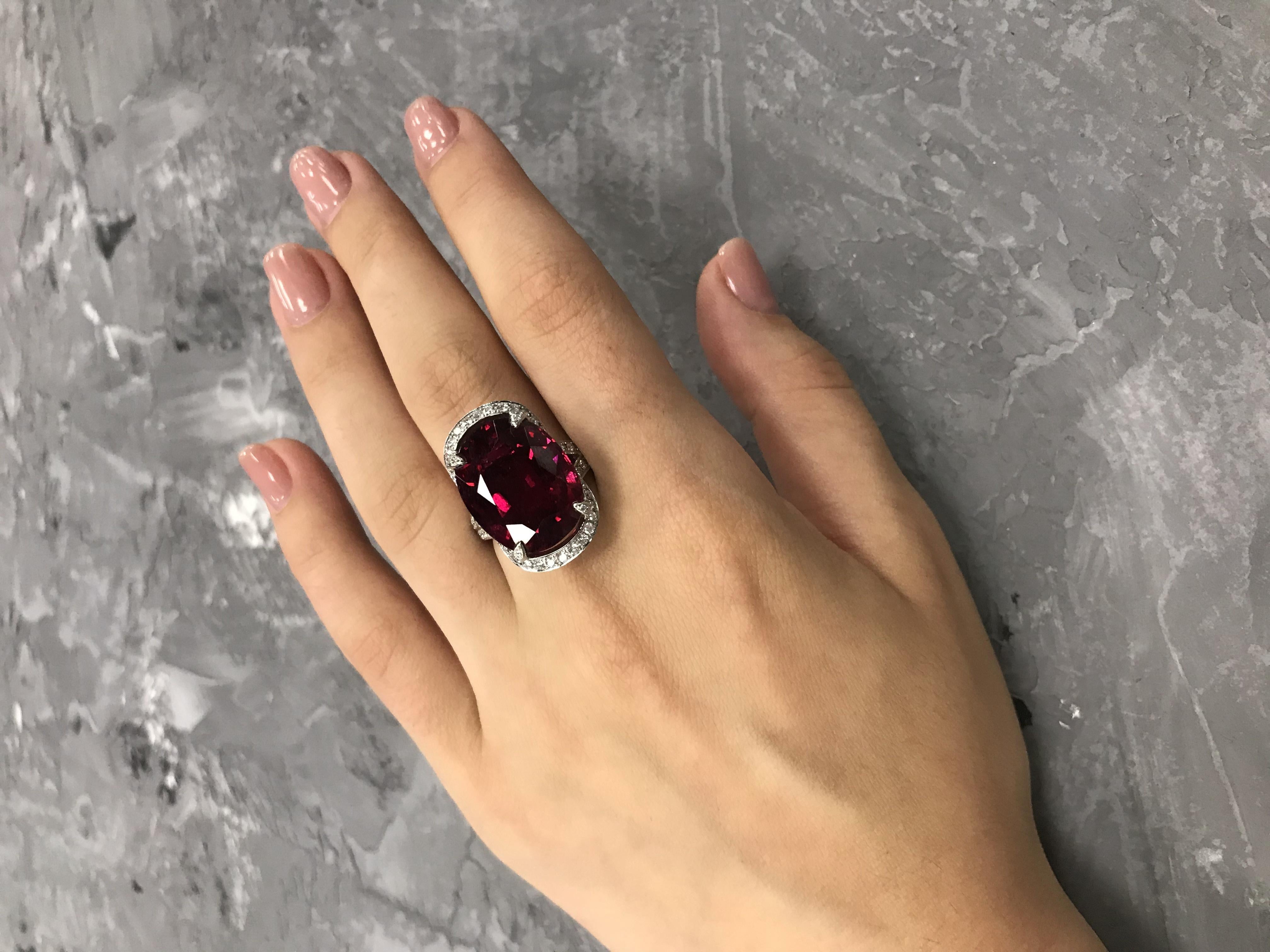Ring White Gold 18 K
Diamond 82-RND-0,99-F/VVS1A 
Diamond 12-RND-0,05-G/VVS1A
Garnet 1-17,95ct 
Weight 11,04 gram
Size 17

With a heritage of ancient fine Swiss jewelry traditions, NATKINA is a Geneva based jewellery brand, which creates modern