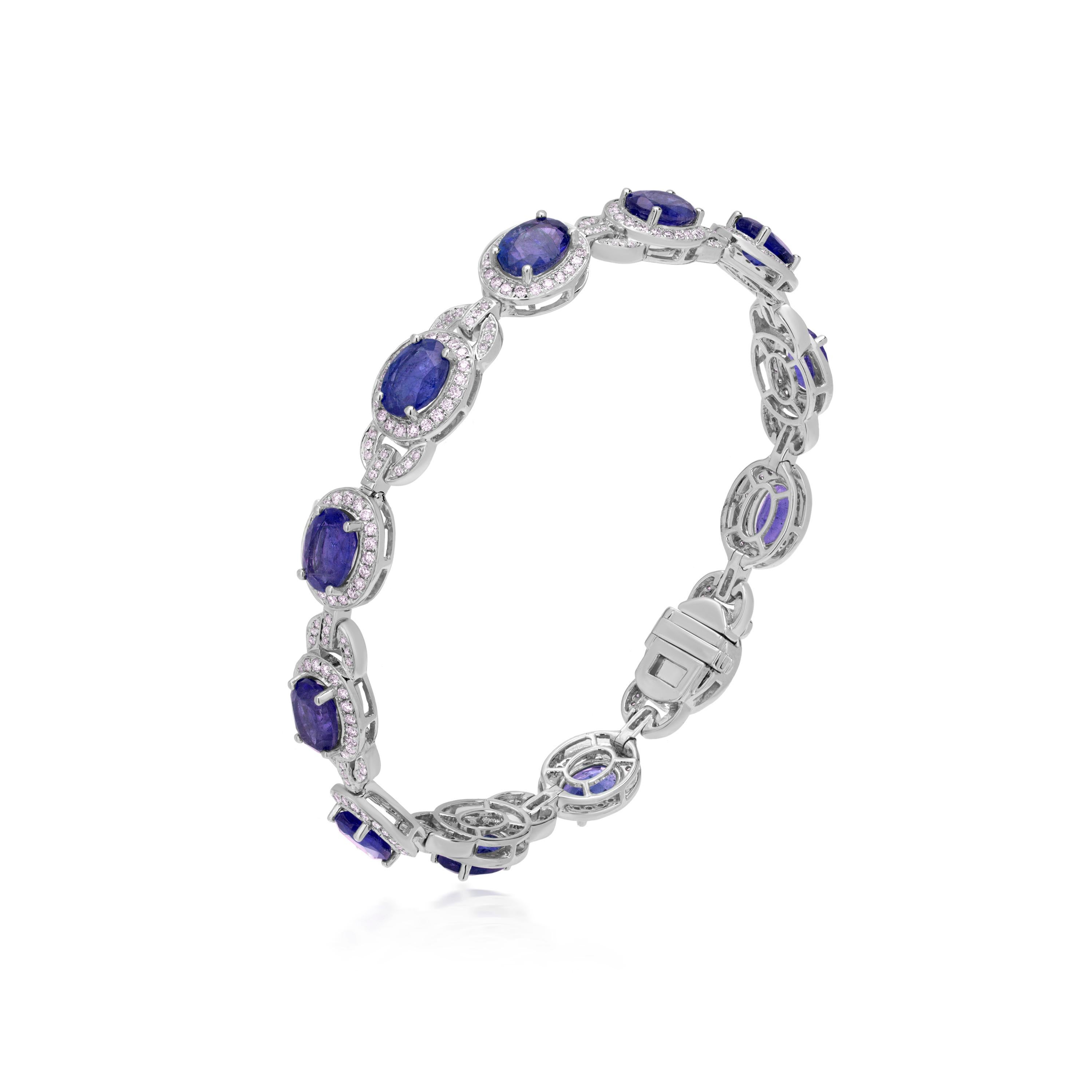 This stunning Nigaam bracelet is fashioned in 18K white gold and features 7.24 carats of Blue Sapphire. 1.45 carats of round full-cut diamonds encircle it, adding to its allure. The delicate design of this bracelet, which includes a box clasp,