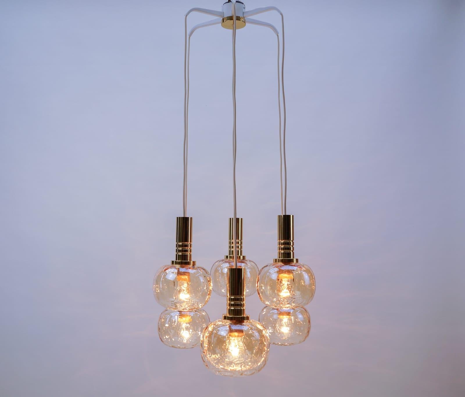 This ceiling lamp features a small frame with seven cascading glass elements with one E27 and six E14 bulb sockets.

Fully functional.

Seven E27 sockets. Works with 220V and 110V.

Wiring is suitable for all countries.