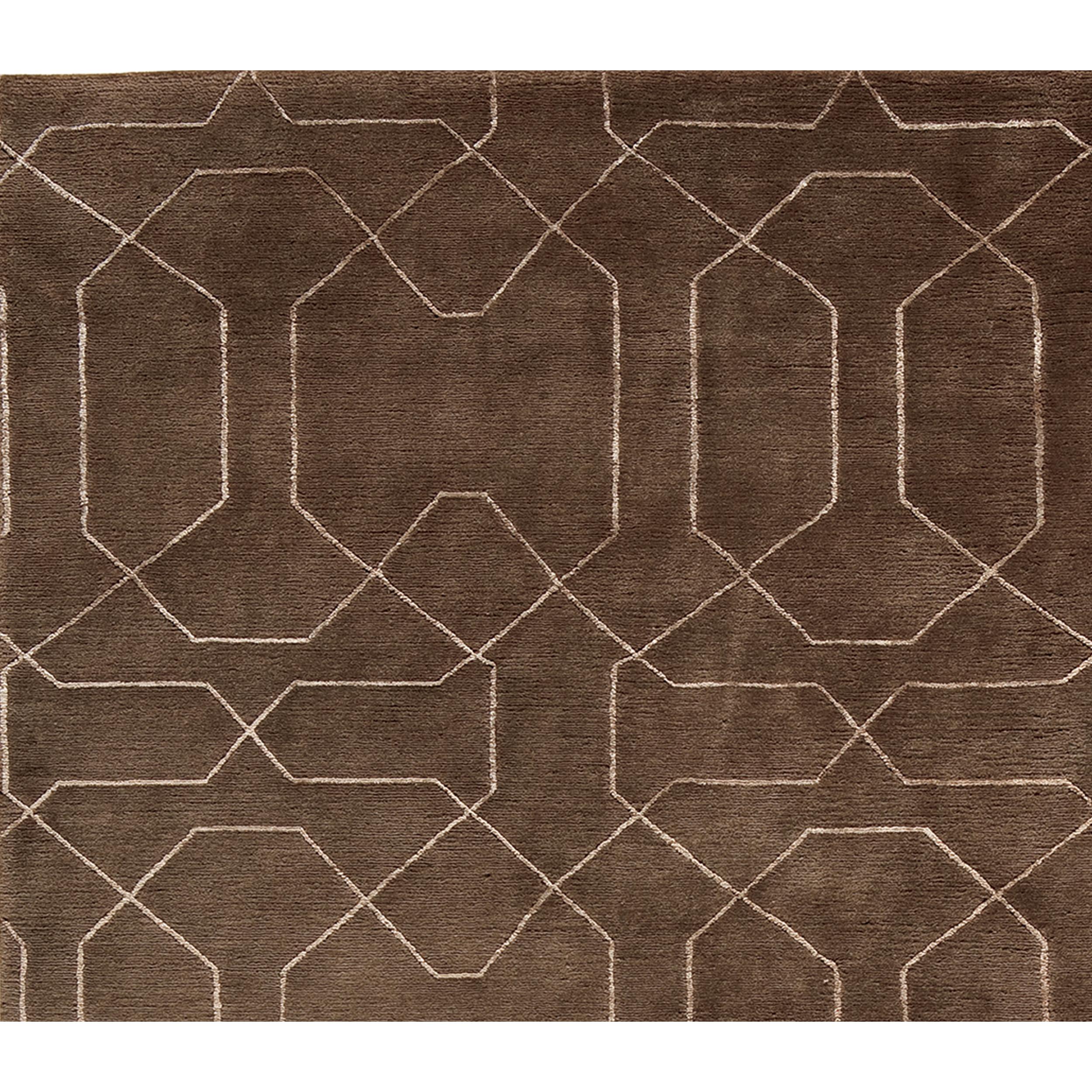 This exquisite modern hand-knotted rug from India offers a delightful sensory experience, captivating both touch and sight with its luscious hand-loomed design. A unique blend of wool and lustrous viscose creates a surface that is not only