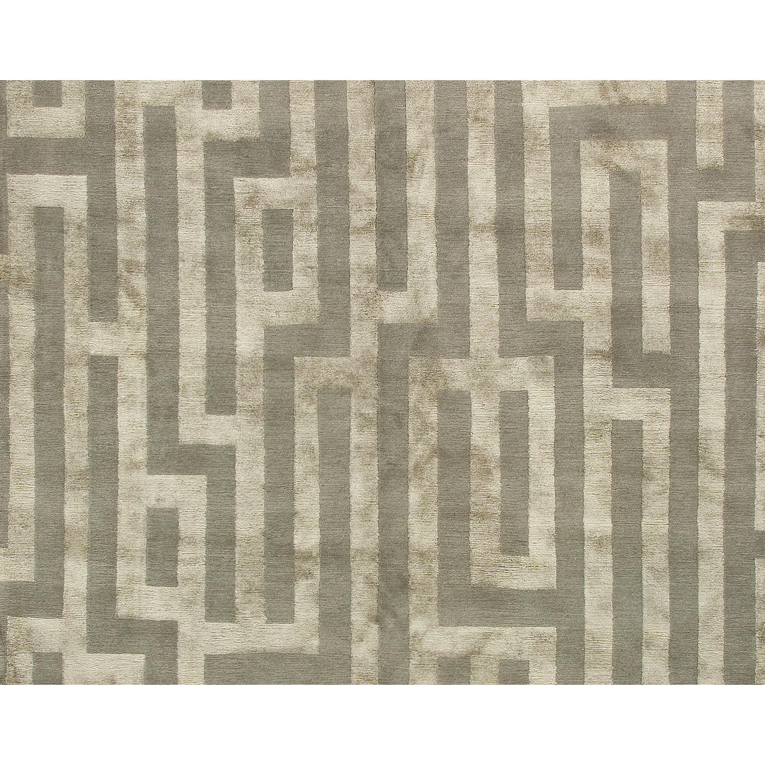 This luxurious modern rug was meticulously hand-knotted in Nepal. Crafted from a harmonious combination of silk and sumptuous wool, its softness, durability, and natural warmth make it an ideal partner to silk, adding a touch of sheer elegance. This