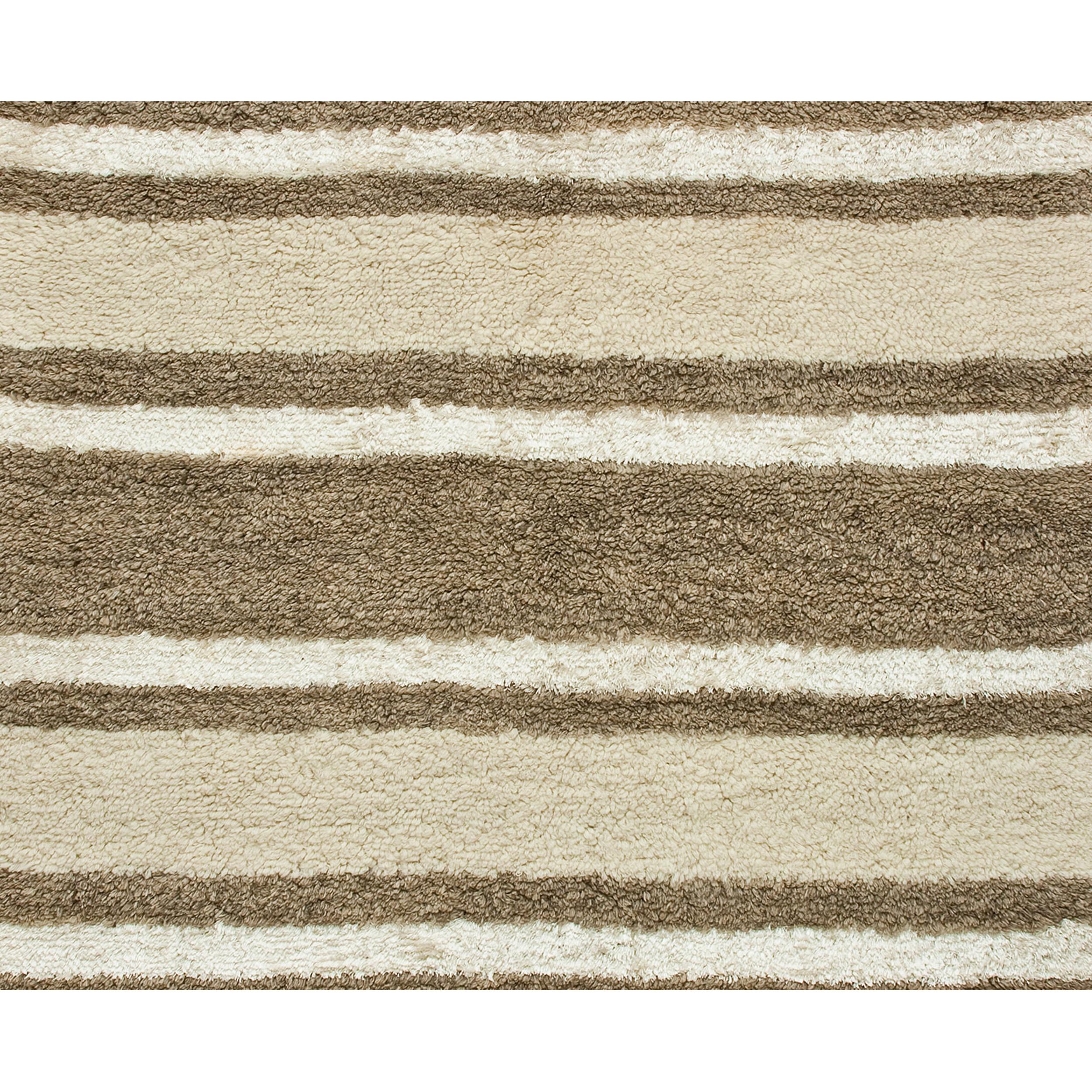 This luxurious modern rug was meticulously handwoven by skilled artisans in Nepal. This rug transcends its utilitarian purpose, becoming a work of art that delights the senses and seamlessly harmonizes with a variety of home decor styles. Every