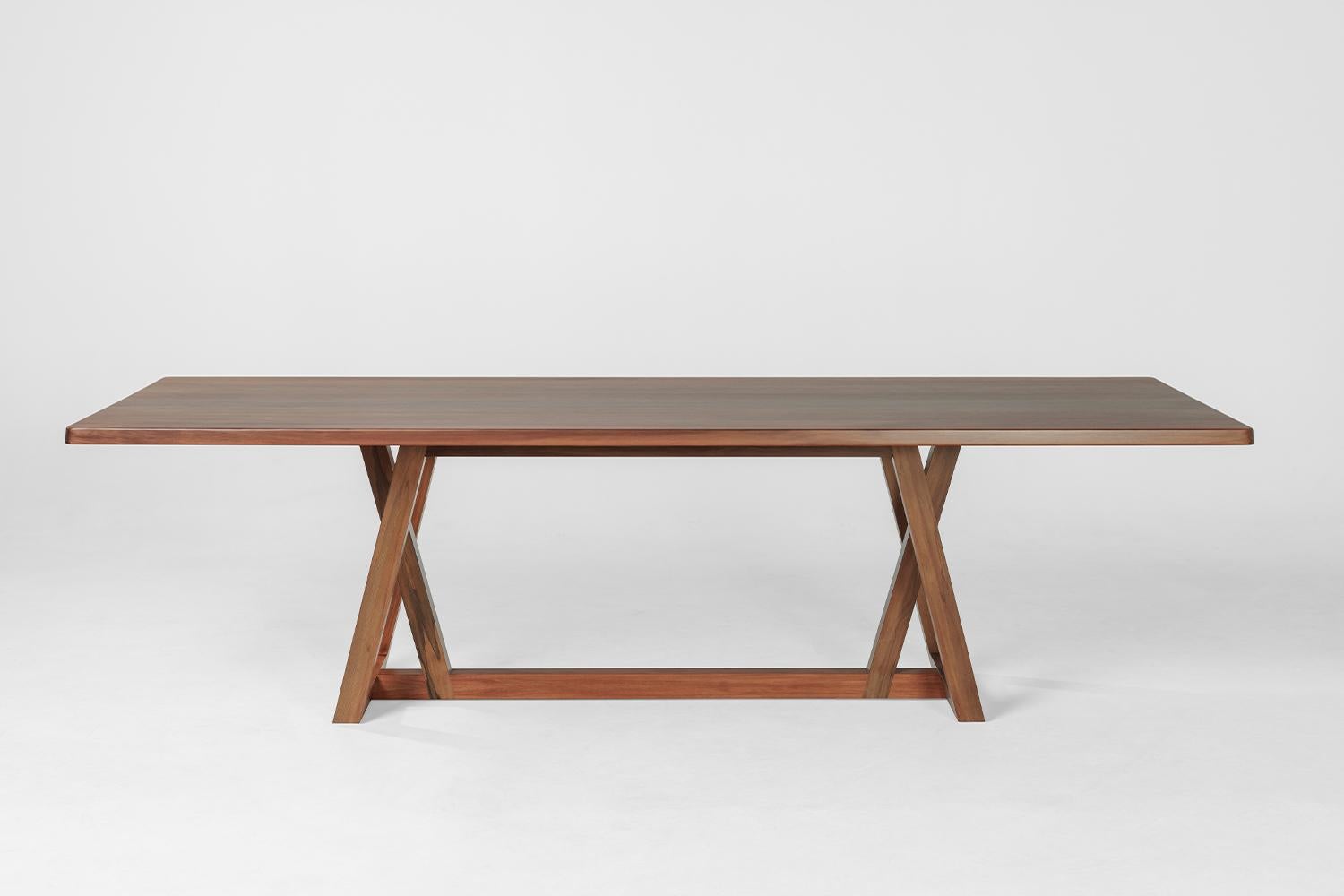 The subtle expression of natural beauty and craftsmanship, the Umber table was created by taking a trapezoid form and establishing juxtapositions with the base and top elements.

The Umber table is made from matai, a New Zealand native tree, rescued