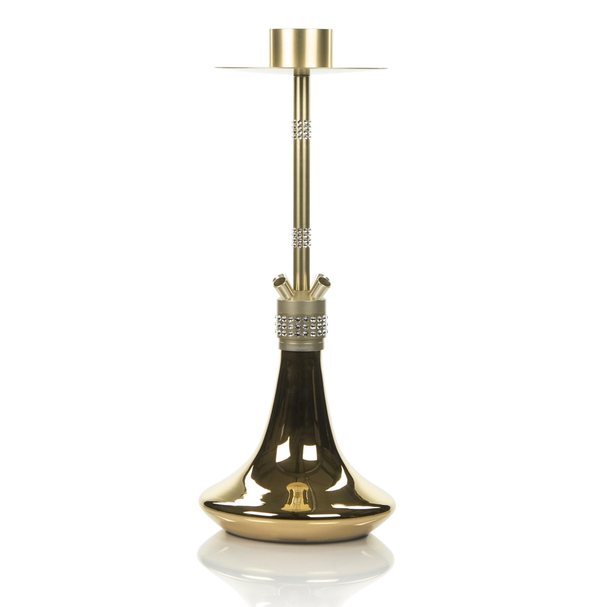 This Shisha is a truly a piece of technological and esthetic perfection. It is made of finest materials such as blown glass coated with pure Gold, Jet-aluminum anodized in Gold, 228 Swarovski Crystals, Crystal Glass-Smoke-Column
Jet-aluminum