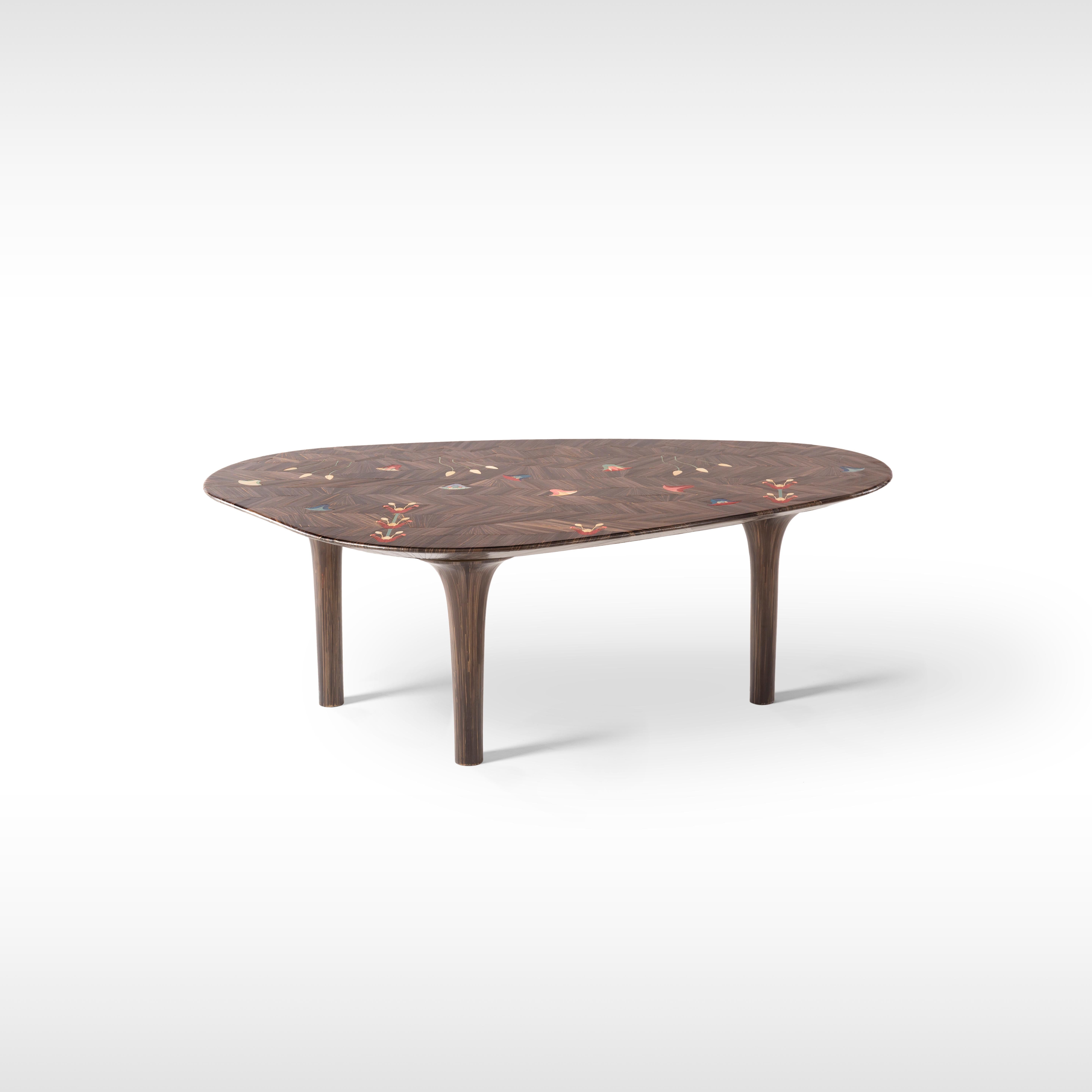 Luxury organic-shaped coffee table with hand-laid bronze straw adorned with hand-crafted colorful lotus flowers.
Adding color, flowers and even more love to our Divine table yields this exquisite jewel of a coffee table. We added another layer of