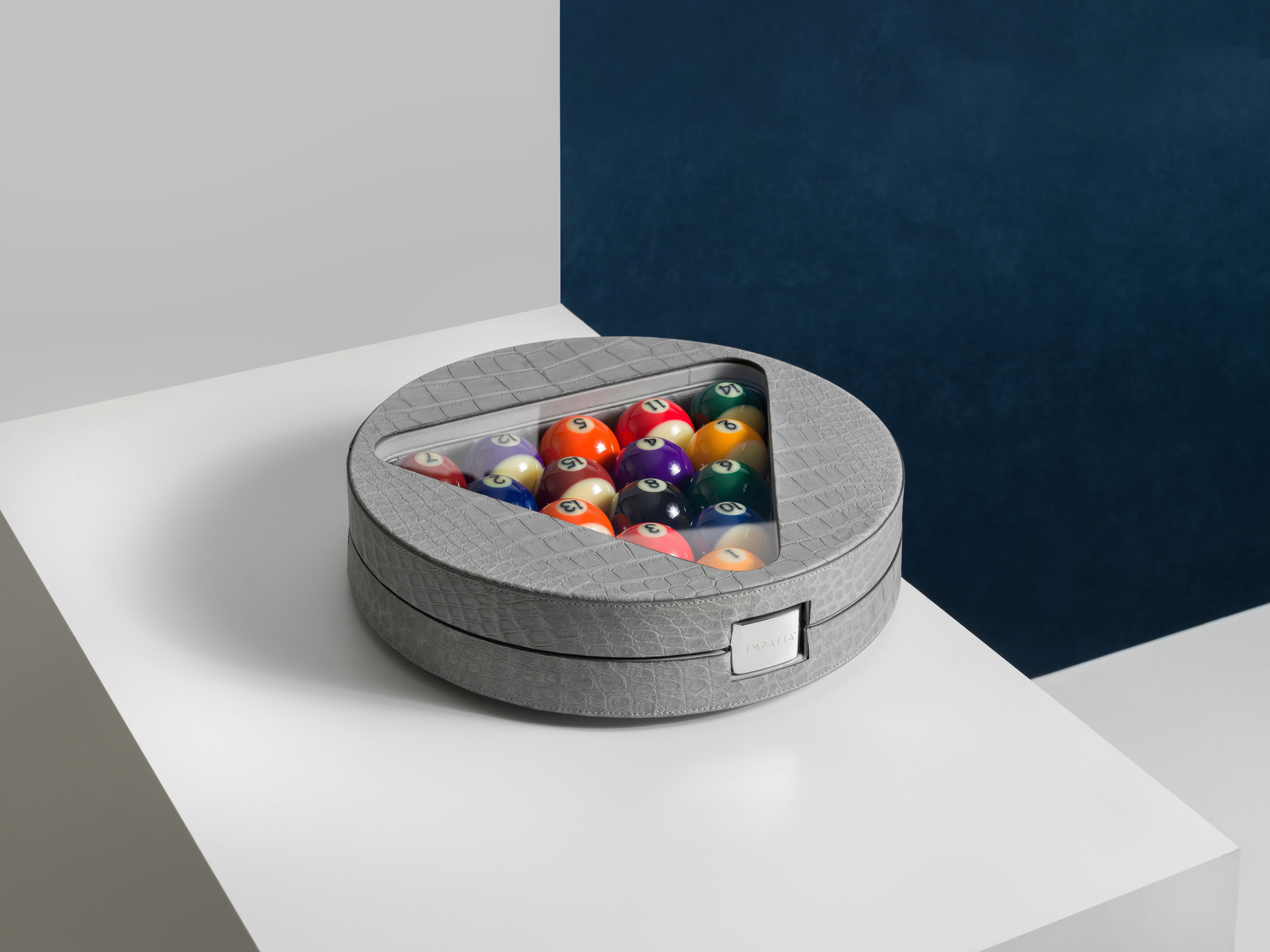 With a continued desire to push the boundaries of luxury design within the game table industry, IMPATIA unveils a brand new contemporary billiards set crafted from genuine crocodile skin. Designed by the IMPATIA R&D team, this bespoke game set is