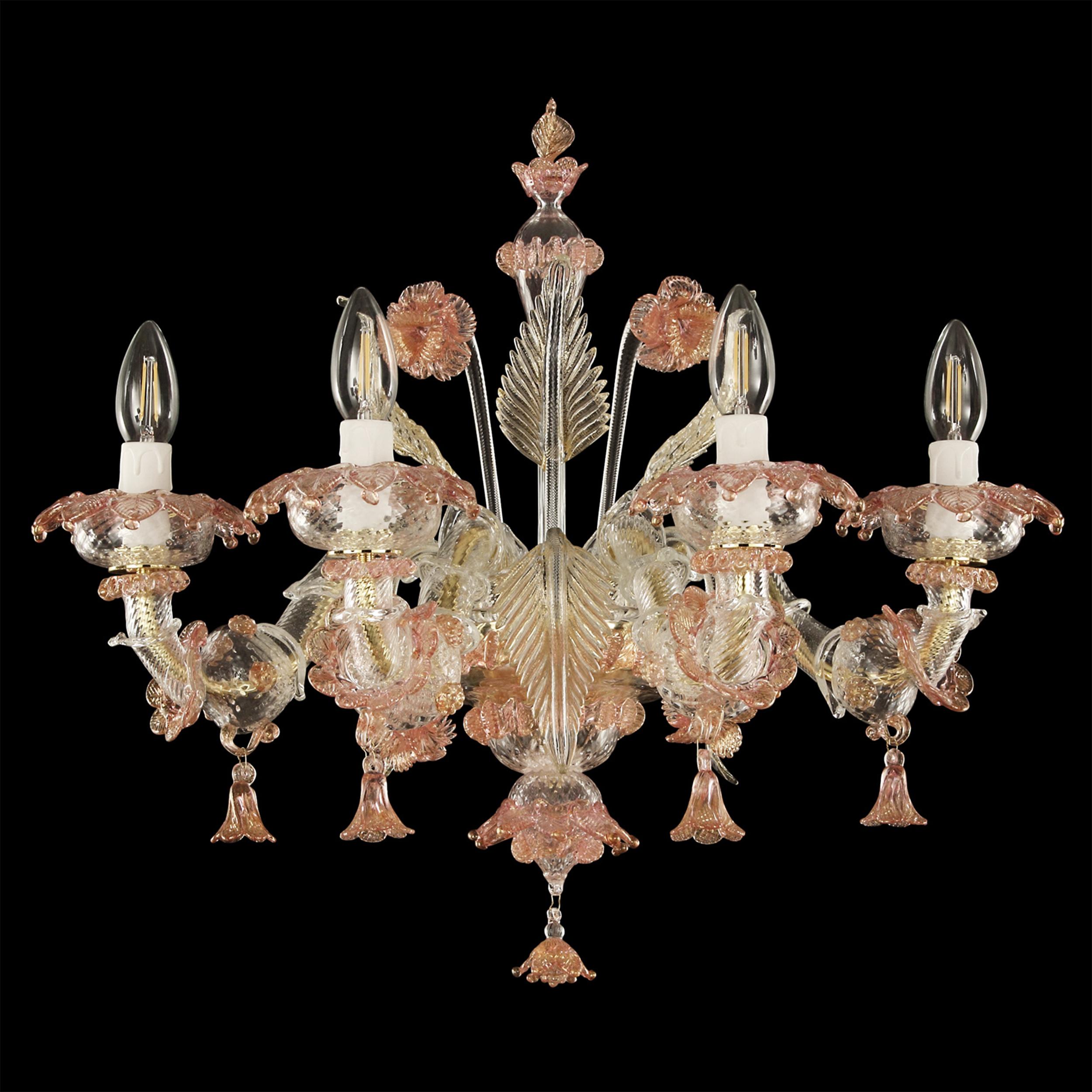 The Murano glass sconce in Rezzonico style is a romantic lighting work, inspired from the luxurious halls of the venetian buildings on the Canal Grande.
The colors, the floral decorations, the Rezzonico arms, the pendant elements… all the
