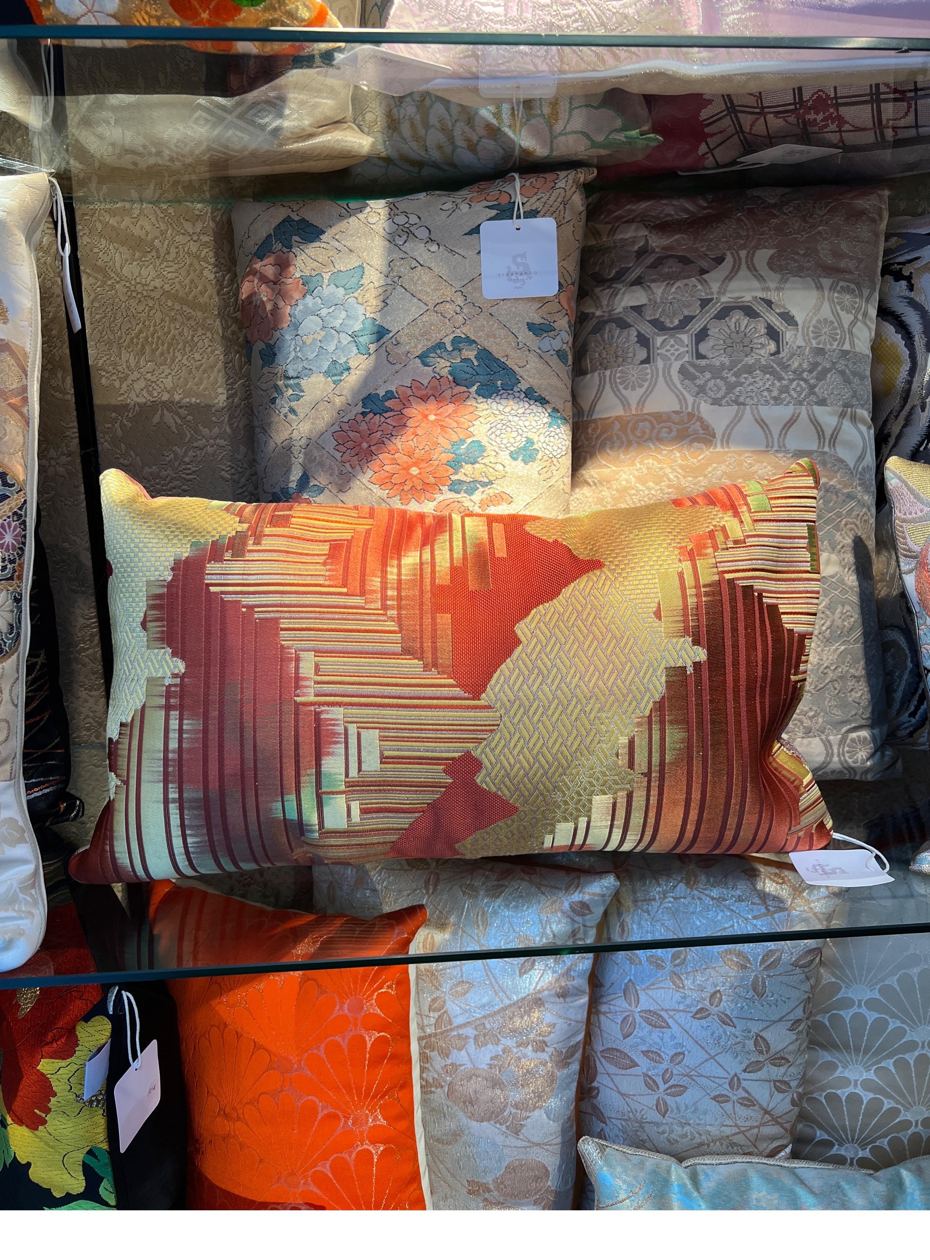 A spectacular lombar pillow wowen in silk and metal threads.

Buying handmade cushions from Sinapango Interiors Paris, crafted from vintage Obi silk made in Nishijin district in Kyoto Japan not only adds an elegant touch but also brings a unique