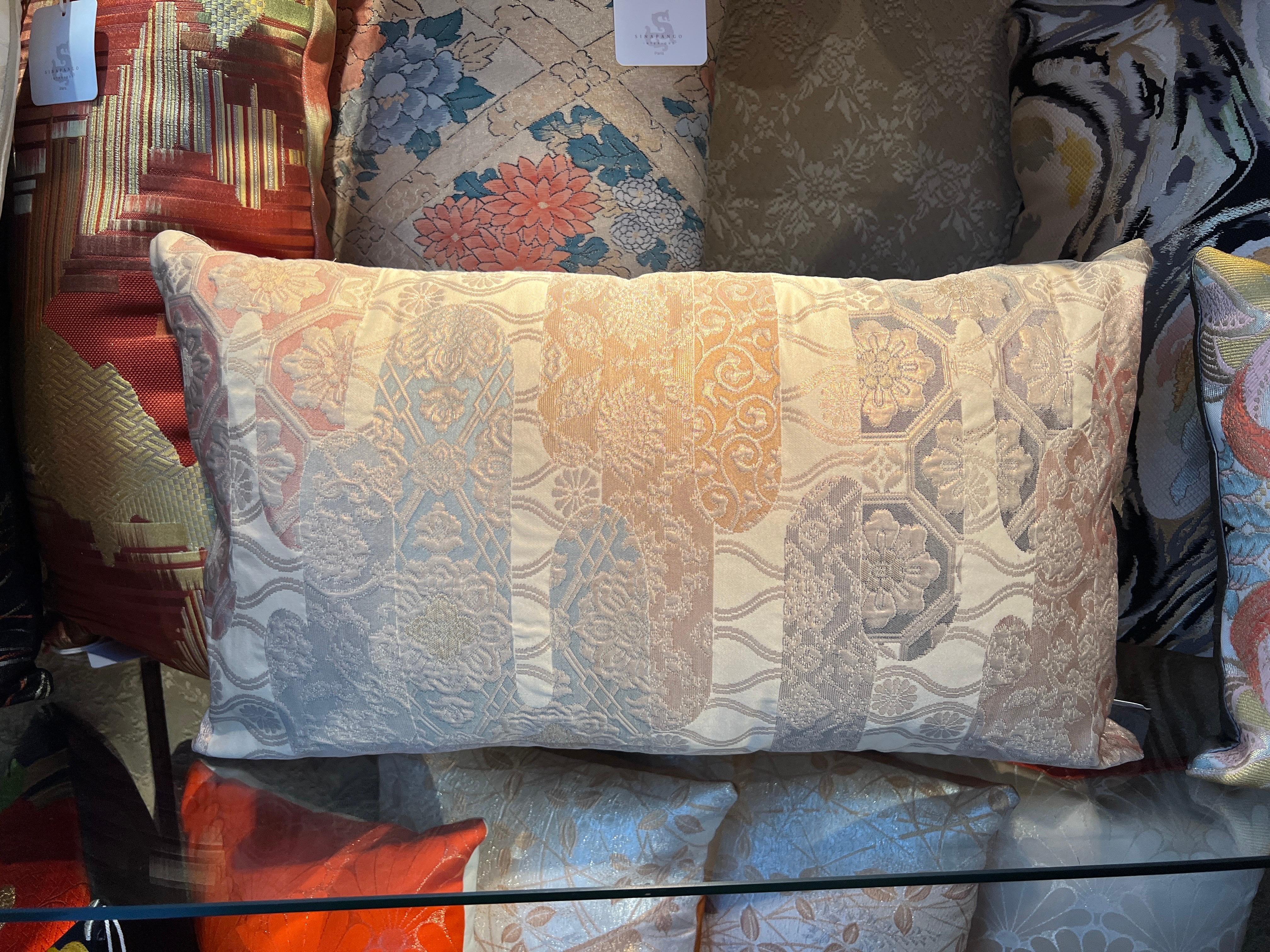 A spectacular lombar pillow wowen in silk and metal threads.

Buying handmade cushions from Sinapango Interiors Paris, crafted from vintage Obi silk made in Nishijin district in Kyoto Japan not only adds an elegant touch but also brings a unique