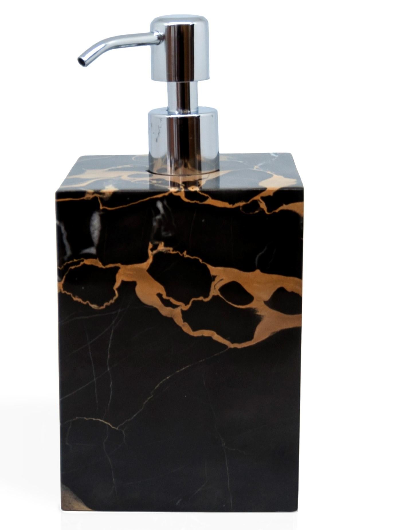 A luxury squared soap dispenser in the rare and beautiful Portoro marble characterised by black color base and golden natural veins. Soap dispenser size 9 x 9 x 19 cm.
Each piece is unique (since each marble block is different in veins and shades)