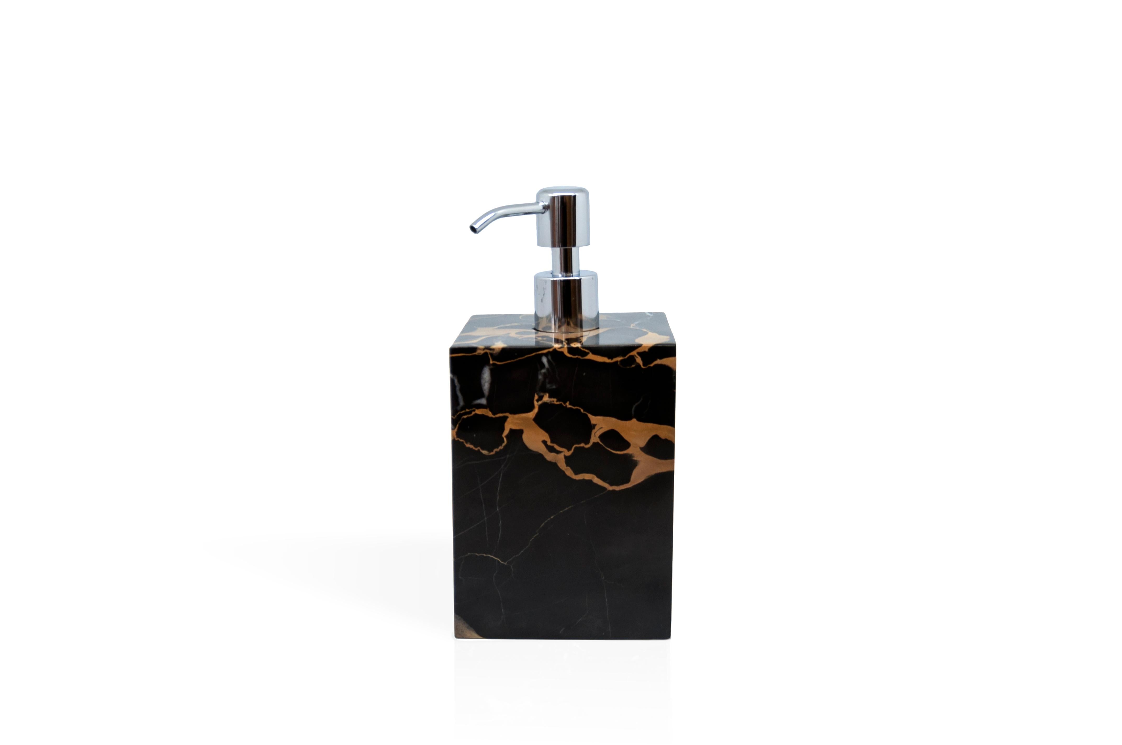 A luxury squared set for the bathroom in the rare and beautiful Portoro marble characterised by black colour base and golden natural veins. The set includes: one soap dispenser (9 x 9 x 19 cm), one toothbrush holder (8.5 x 8.5 x 12 cm), one box