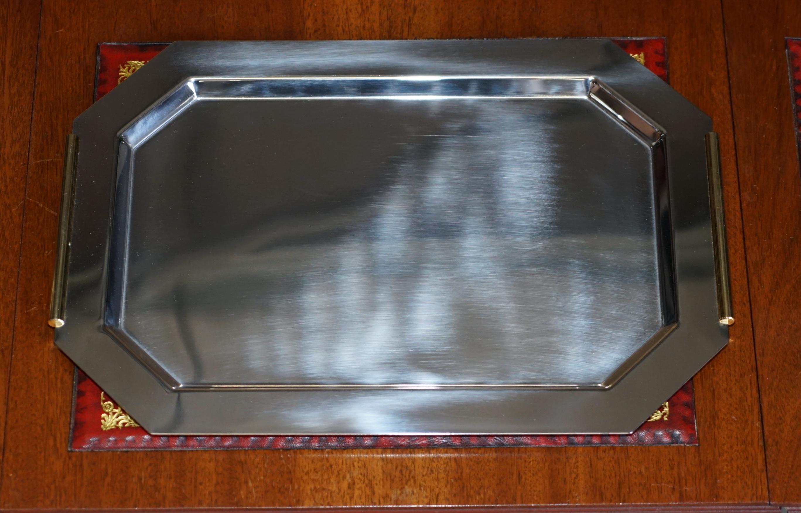 We are delighted to offer for sale this lovely Van Cleef & Arpels tray in chrome with gold gilt handles 

A good looking and highly decorative serving tray which brings a sense of occasion to serving drinks

The tray comes with a cover case to