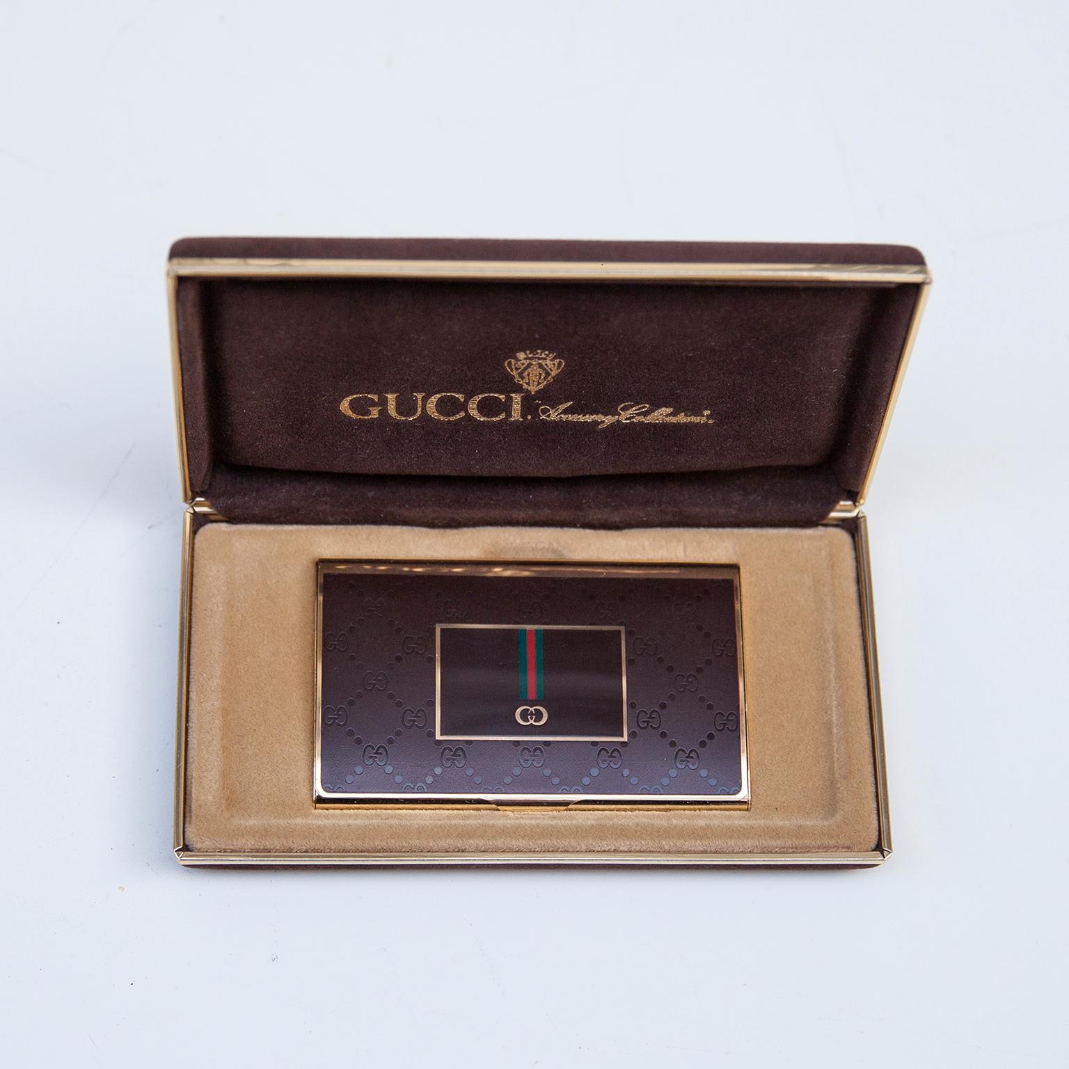 Luxury vintage Gucci business card holder in perspex and brass covered in original box from the Gucci accessory collection signed with the golden Gucci sign.