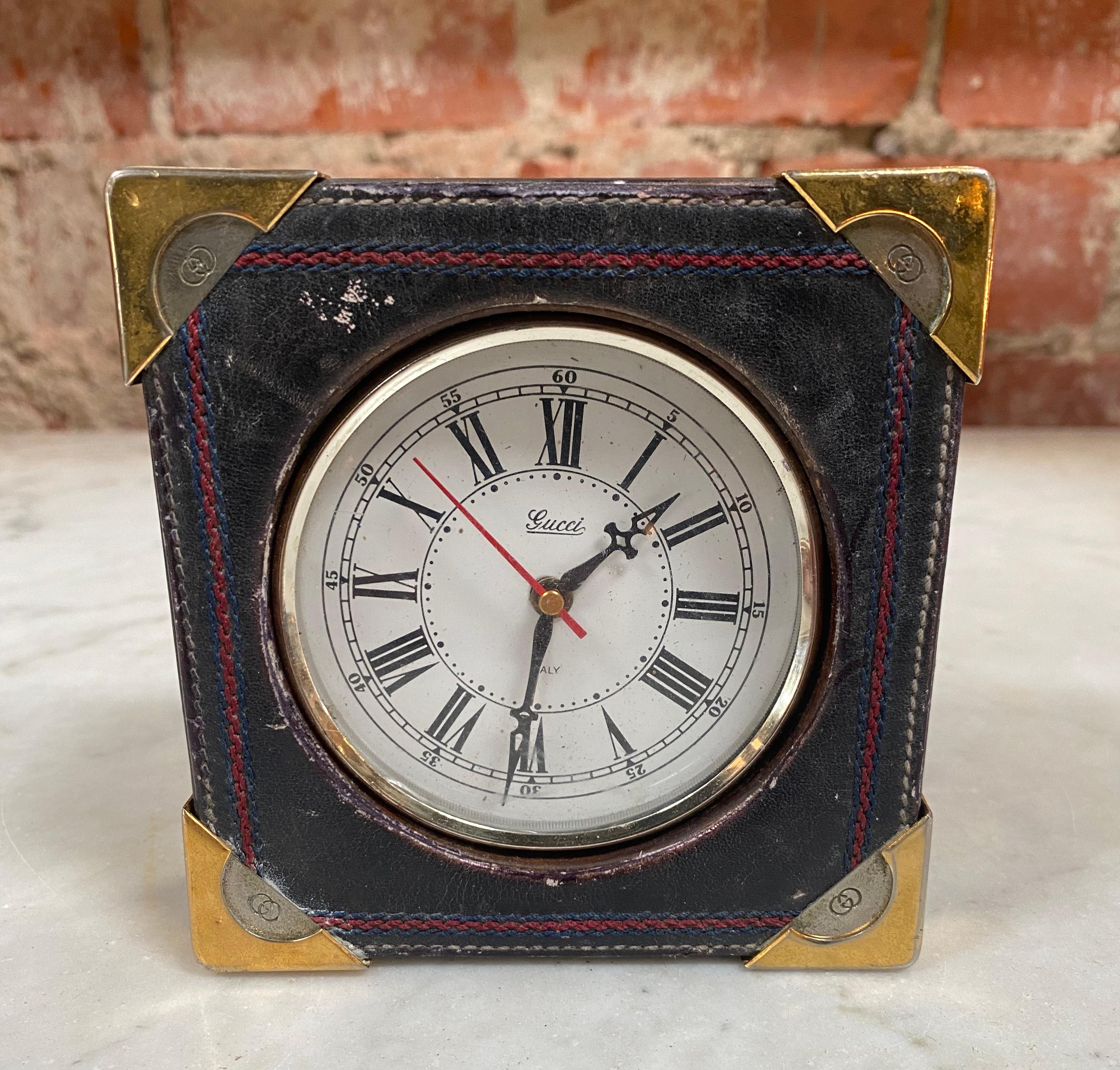 Elegant vintage Gucci table clock made in leather wood and bras, marked with Gucci.
 