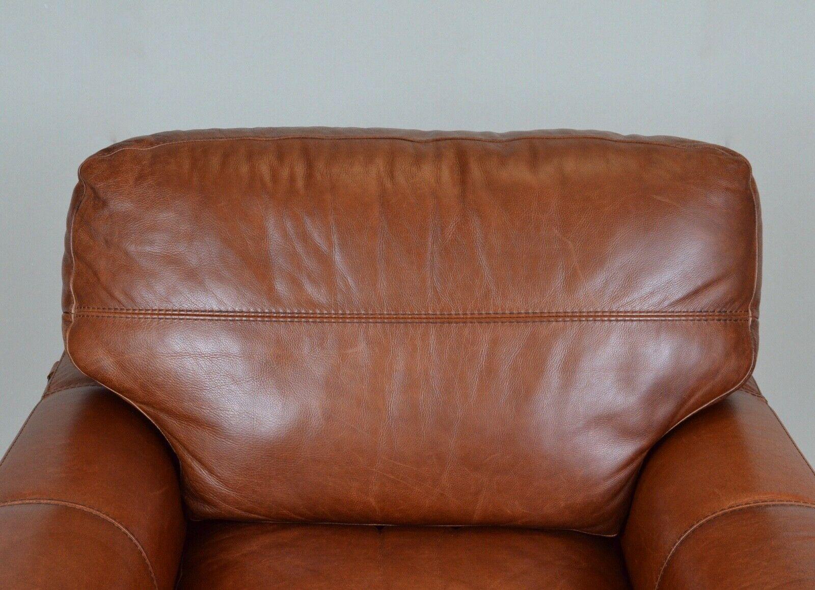 tan leather armchairs
