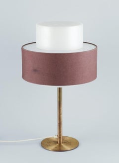 Luxus, Sweden. Large table lamp in brass, shade in plastic and brown fabric.