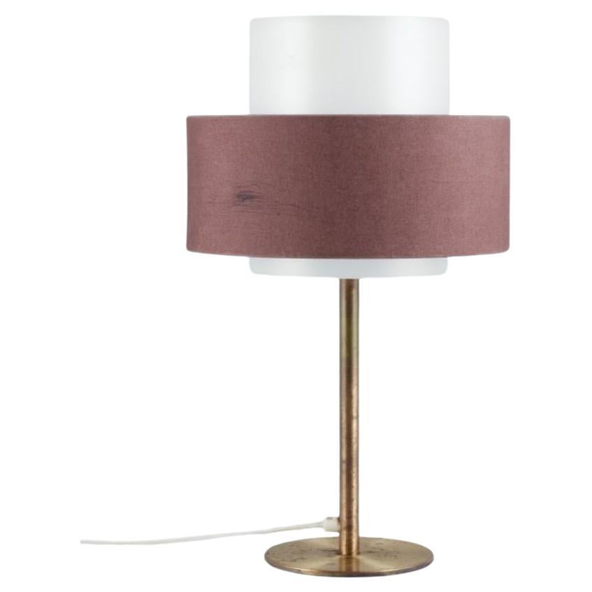 Luxus, Sweden. Large table lamp in brass, shade in plastic and brown fabric. For Sale