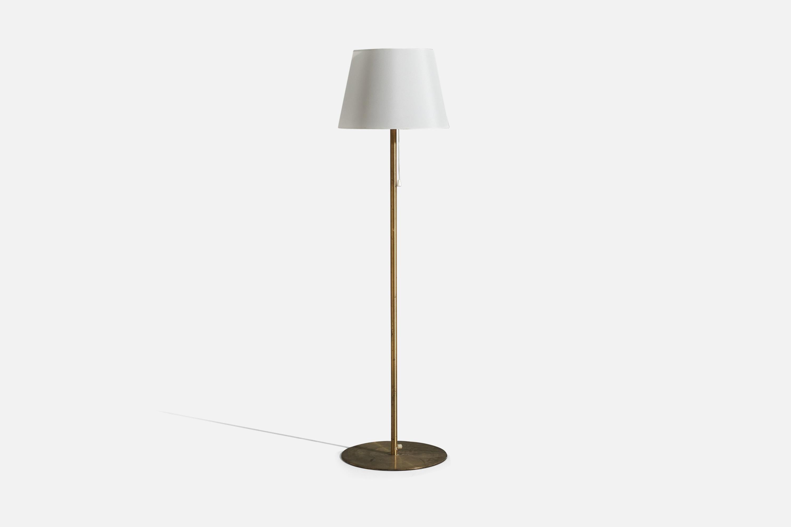 A brass floor lamp with a fabric lampshade, designed and produced by Luxus Vittsjö, Sweden, 1960s.

Sold with Lampshade 
Dimensions of Floor Lamp (inches) : 48.25 x 13.875 x 13.875 (H x W x D)
Dimensions of Shade (inches) : 13 x 15 x 10 (T x B x