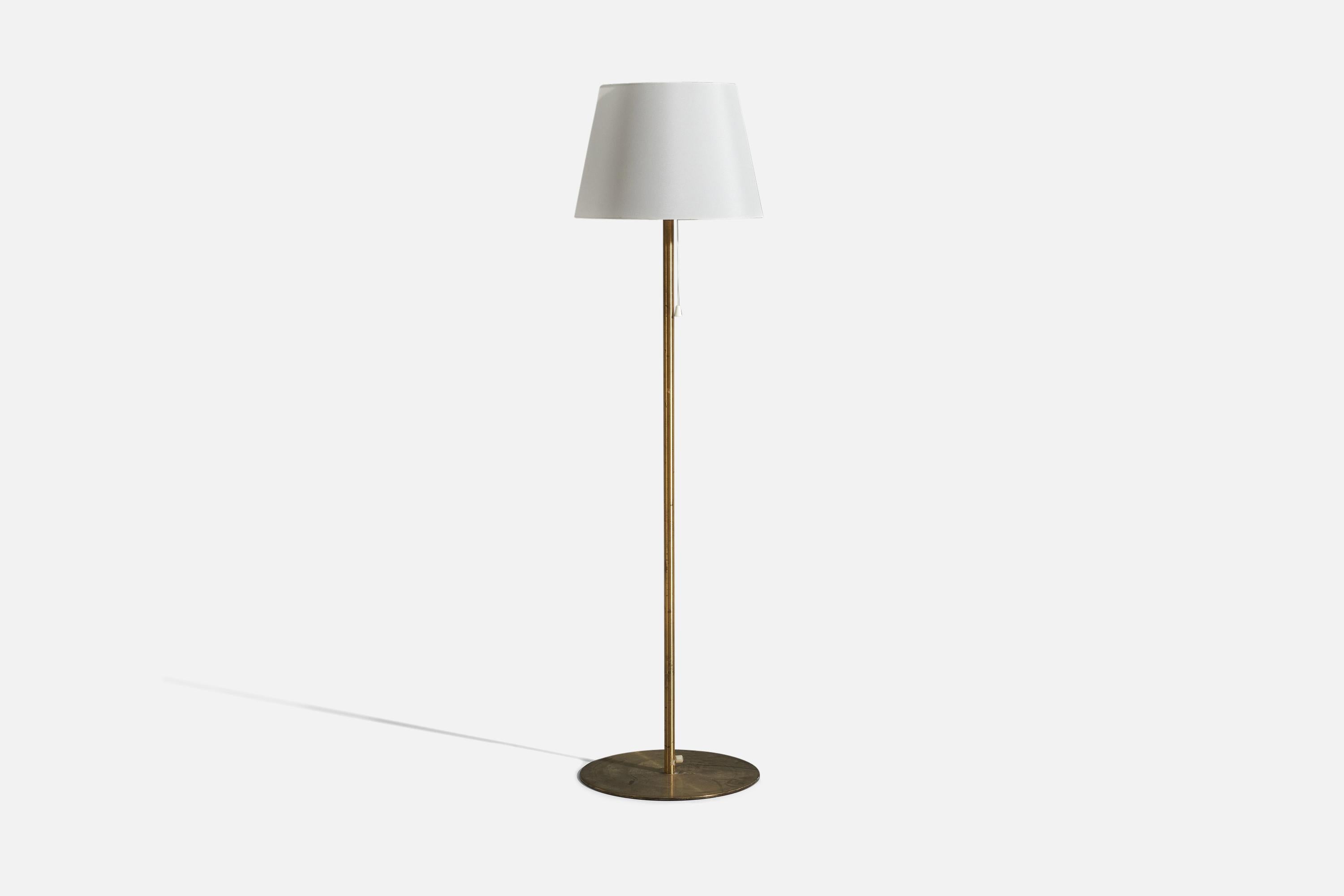 A brass floor lamp with a fabric lampshade, designed and produced by Luxus Vittsjö, Sweden, 1960s.

Sold with lampshade 
Dimensions of floor lamp (inches) : 48.25 x 13.875 x 13.875 (H x W x D)
Dimensions of shade (inches) : 13 x 15 x 10 (T x B x
