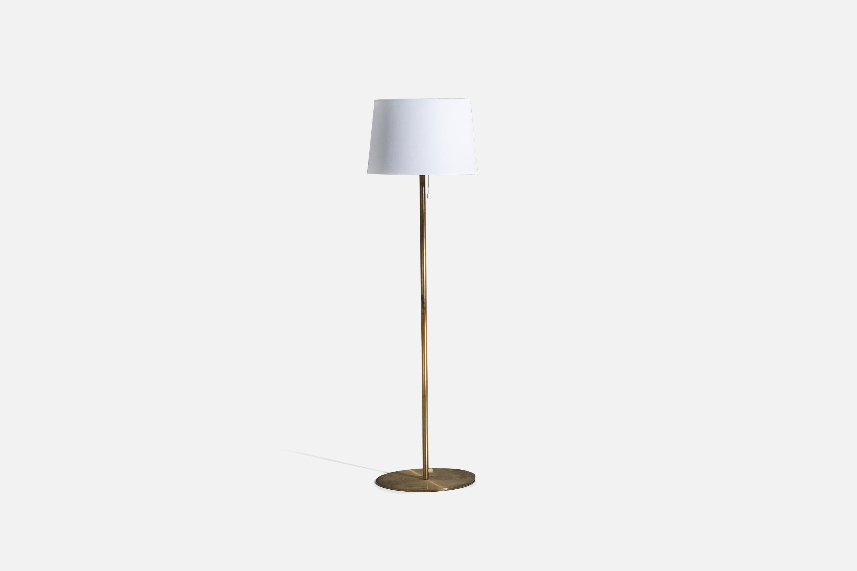 A brass floor lamp with a fabric lampshade, designed and produced by Luxus Vittsjö, Sweden, 1960s.

Sold with Lampshade 
Dimensions of Floor Lamp (inches) : 48.1875 x 13.75 x 13.75 (H x W x D)
Dimensions of Shade (inches) : 13 x 15 x 10 (T x B x