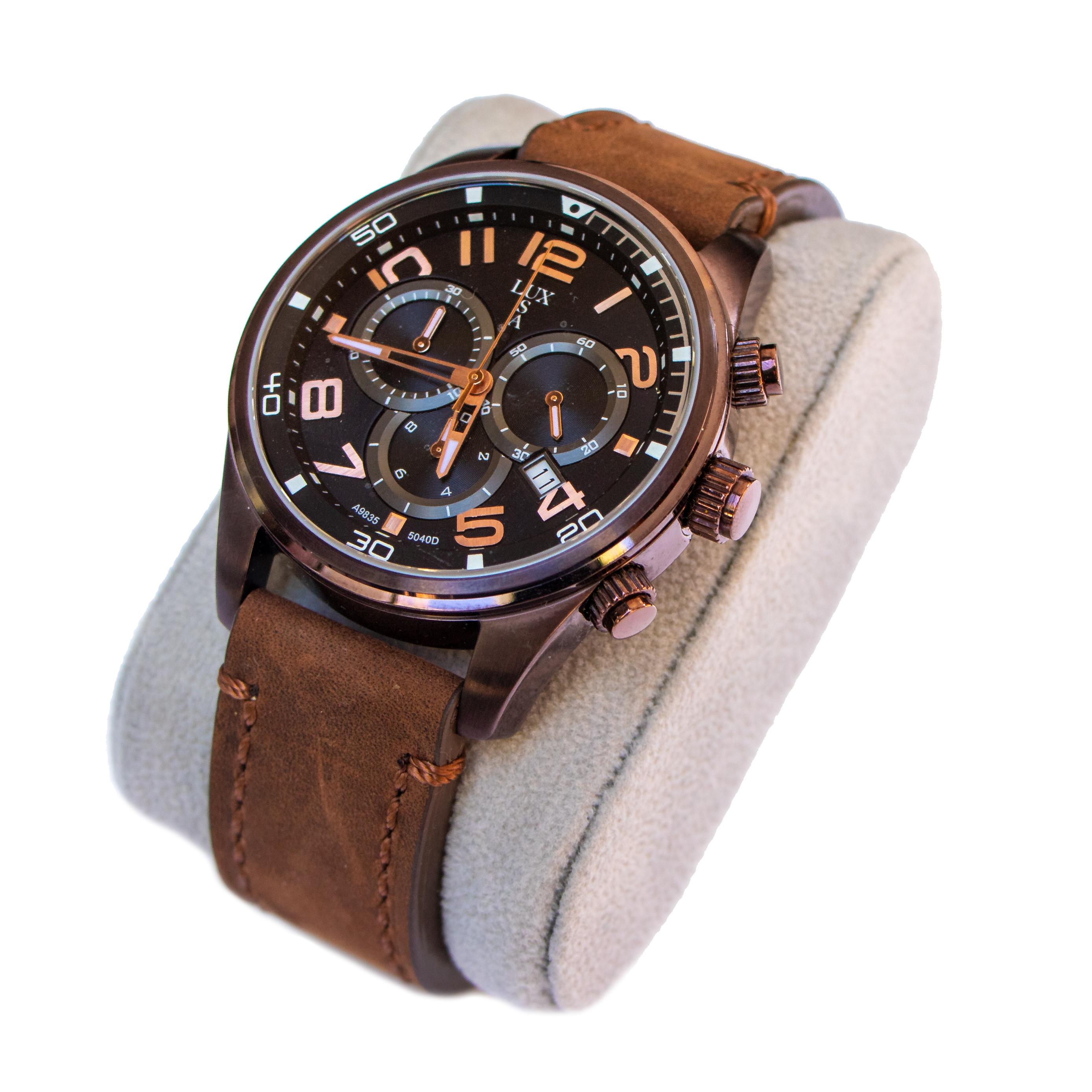 Beautiful stainless steel watch with a black face and brown leather strap. This watch has a date window and features chronograph capabilities - 3 miniature dials that keep track of milliseconds, seconds, and minutes which are all Swiss made and US