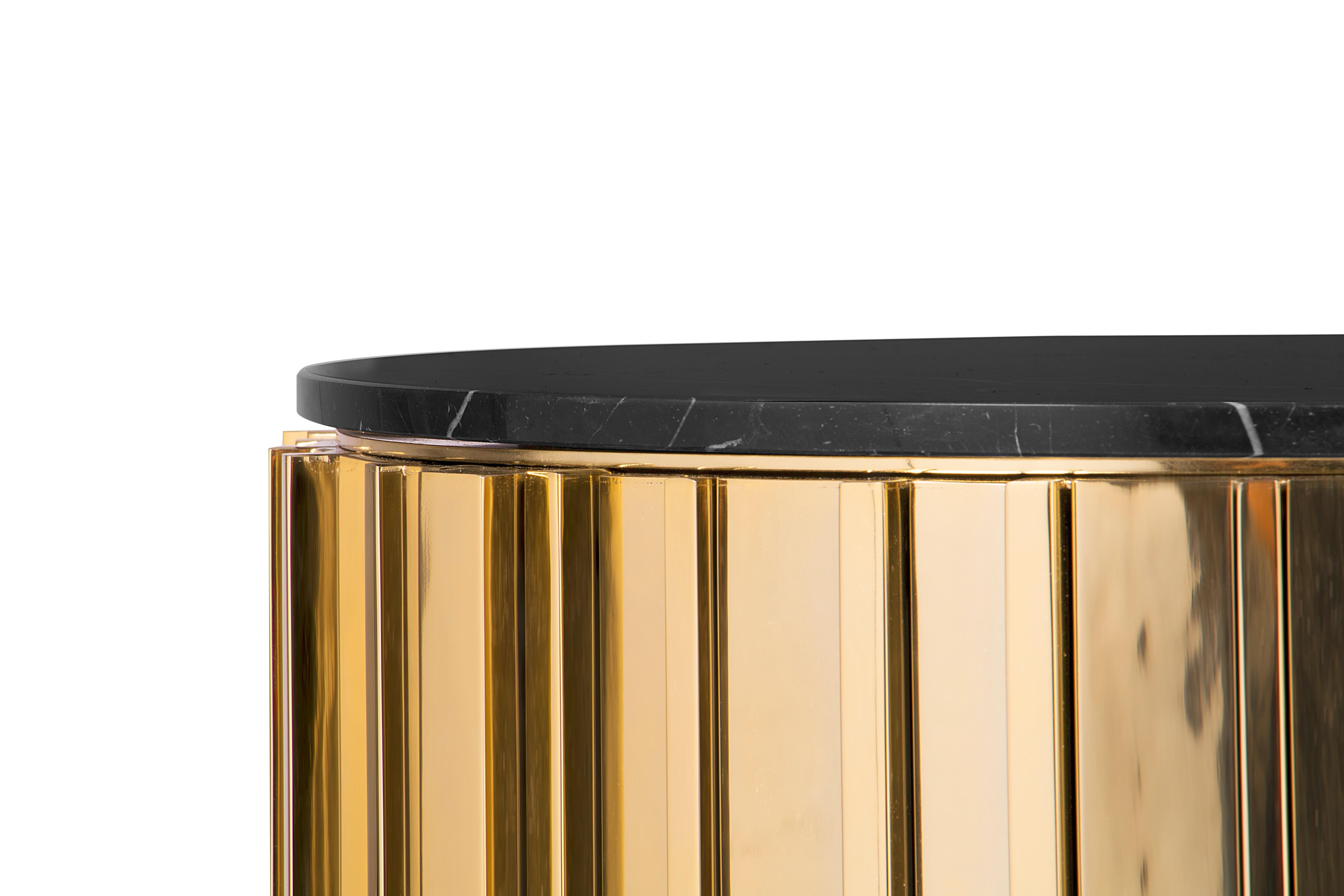 Empire State Building was the inspiration for this stunning side table. It adds a classic yet modern appeal to any space. Made with the highest quality of brass and Nero Marquina marble, this is ideal to create a spectacular and sophisticated living