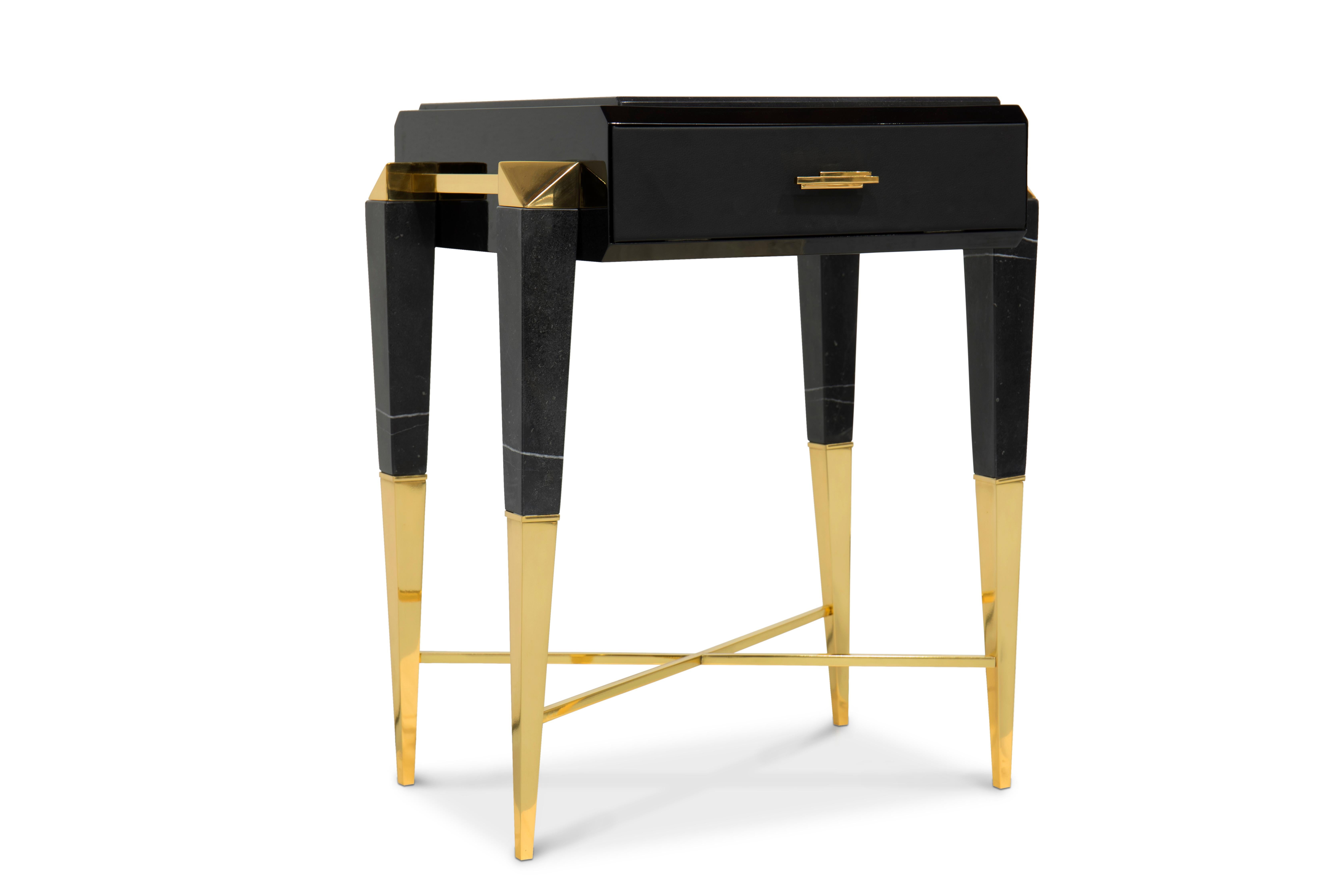 Inspired by Ancient Rome, the spear side table features a timeless design on which sleek gold plated lines support a rectangular platform made in Nero Marquina marble. The base is dramatically tapered allowing a beautiful intersected boundary. A