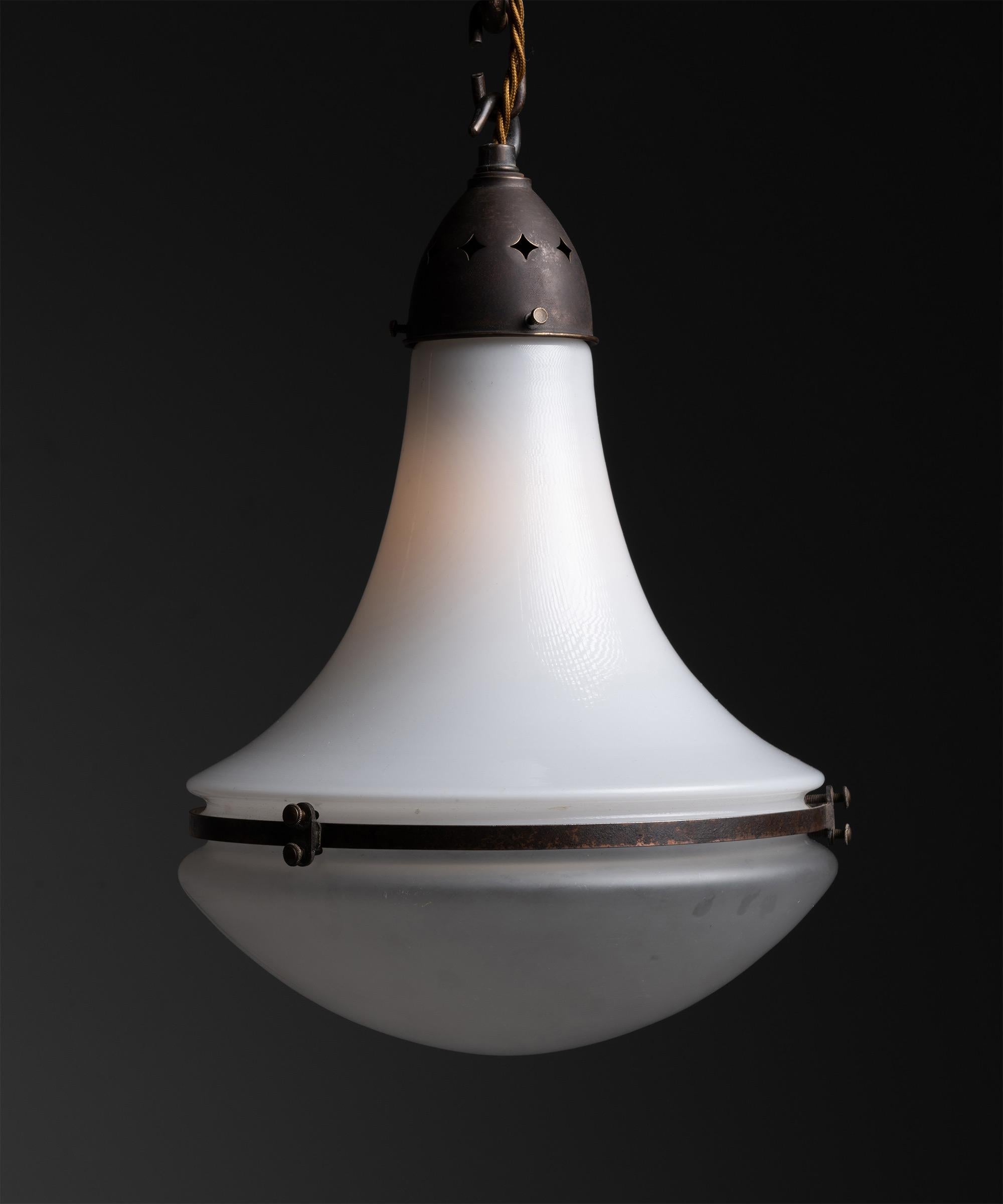 Luzette pendant by Peter Behrens, Germany circa 1930.

With frosted glass top and opaline glass bottom, secured with copper fitter and brace. Manufactured by AEG Siemens with manufacturer's mark.

Measures: 10