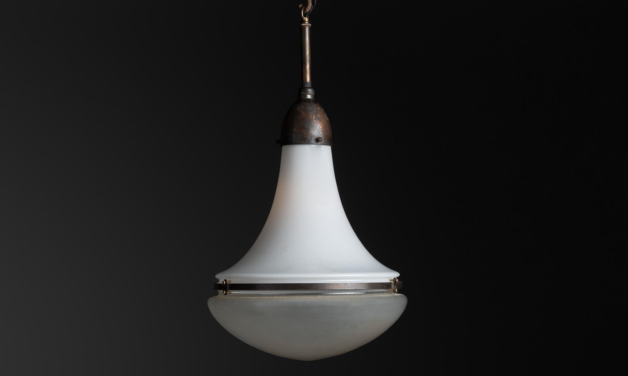Luzette Pendant by Peter Behrens

Germany circa 1920

White glass upper shade with etched glass diffuser, and oxidized steel brace and gallery.

12.5”dia x 22”h