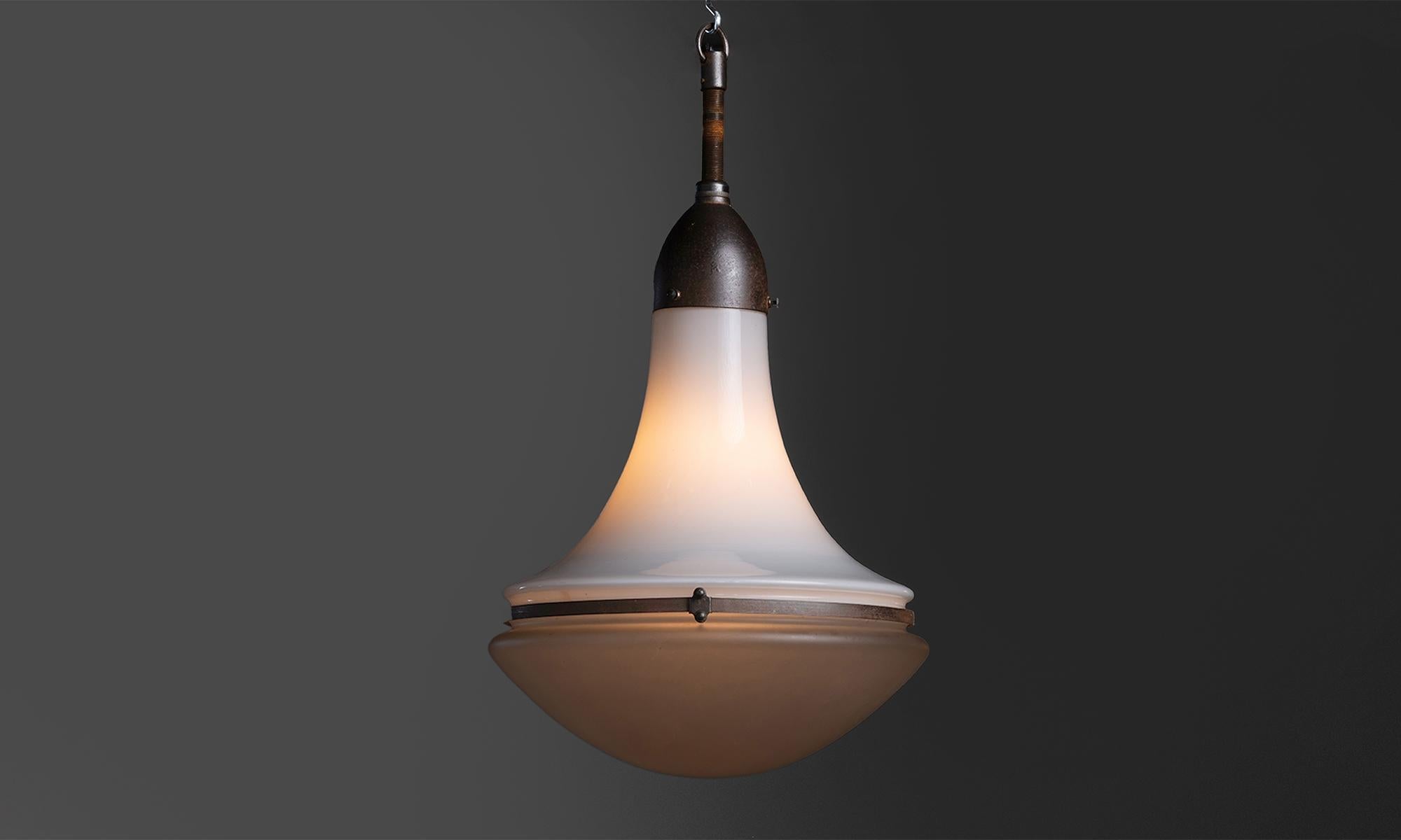 Luzette Pendant by Peter Behrens

Germany circa 1920

White glass upper shade with etched glass diffuser, and oxidized steel brace and gallery.

15”dia x 23”h