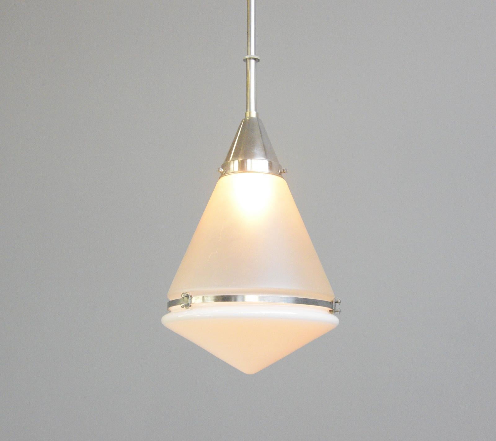 Luzette Pendant Light By Peter Behrens For Siemens Circa 1920s

- Acid etched glass top
- Opaline glass bowl
- Takes E27 fitting bulbs
- Model L1724
- Nickel gallery and rim
- Produced by Siemens & Schukert, Berlin
- Designed by Peter
