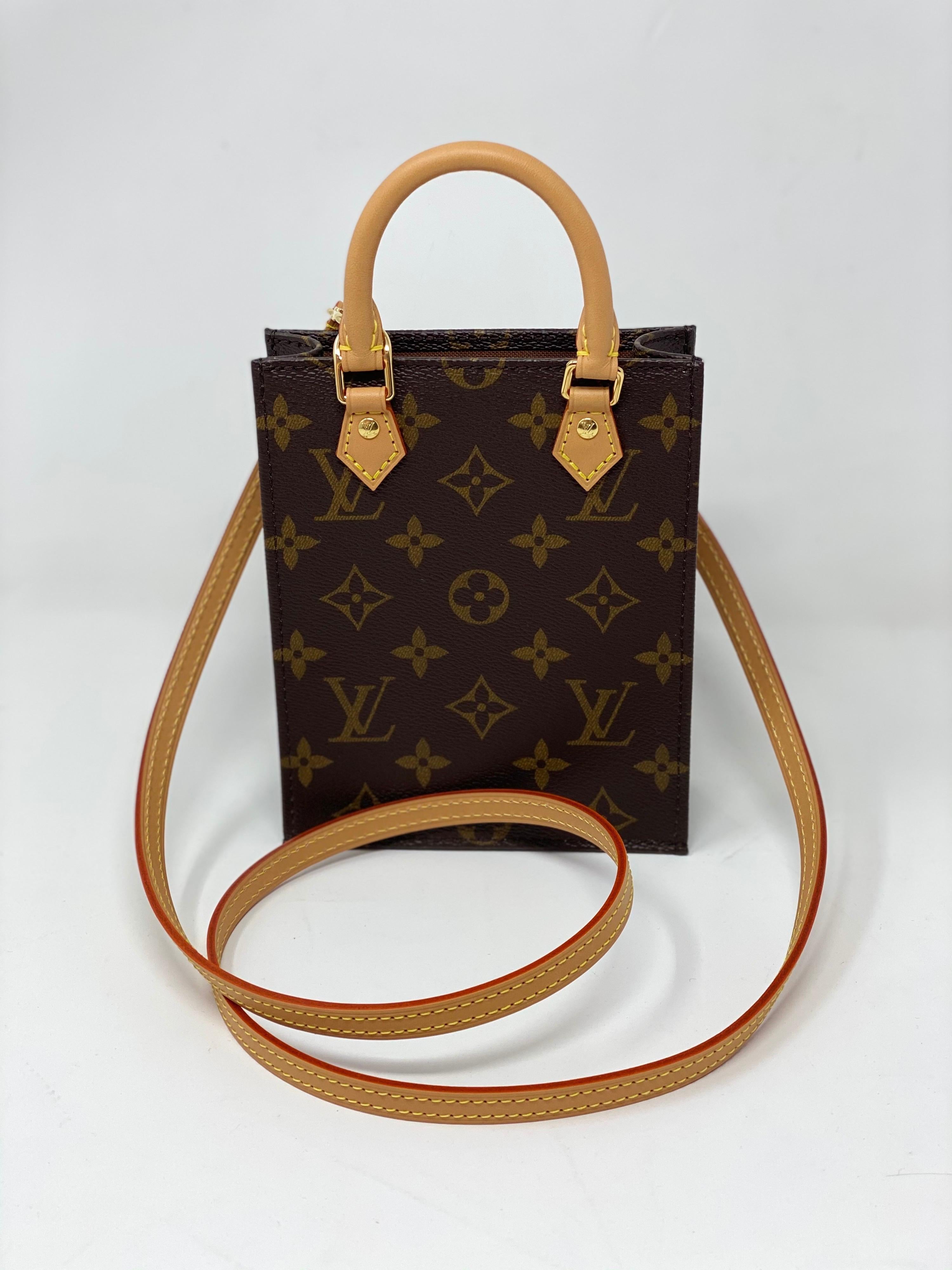 Louis Vuitton Mini Sac Plat Crossbody Bag. Rare and limited bag. Brand new. Cute mini version of the classic big Sac Plat tote that is retired from LV. Monogram canvas with leather strap and handles. Don't miss out on this collector's piece.