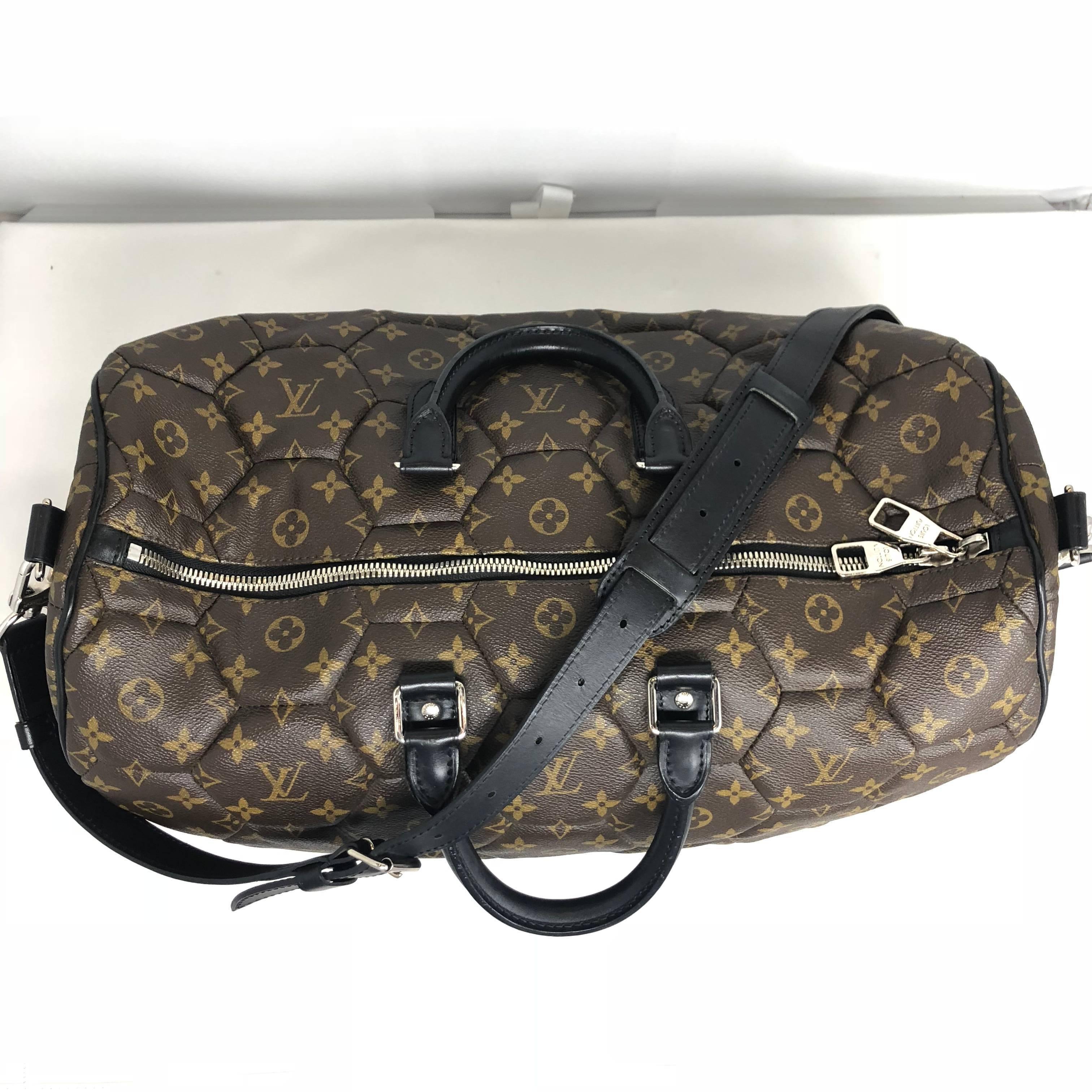 LV Monogram Hexagone Keepall with detachable strap. From the LV Fall/Winter 2009 Menswear Collection. This soccer inspired bag was created by hand sewing hexagonal LV monogram pieces together to create the patchwork effect. LV craftsmanship at its