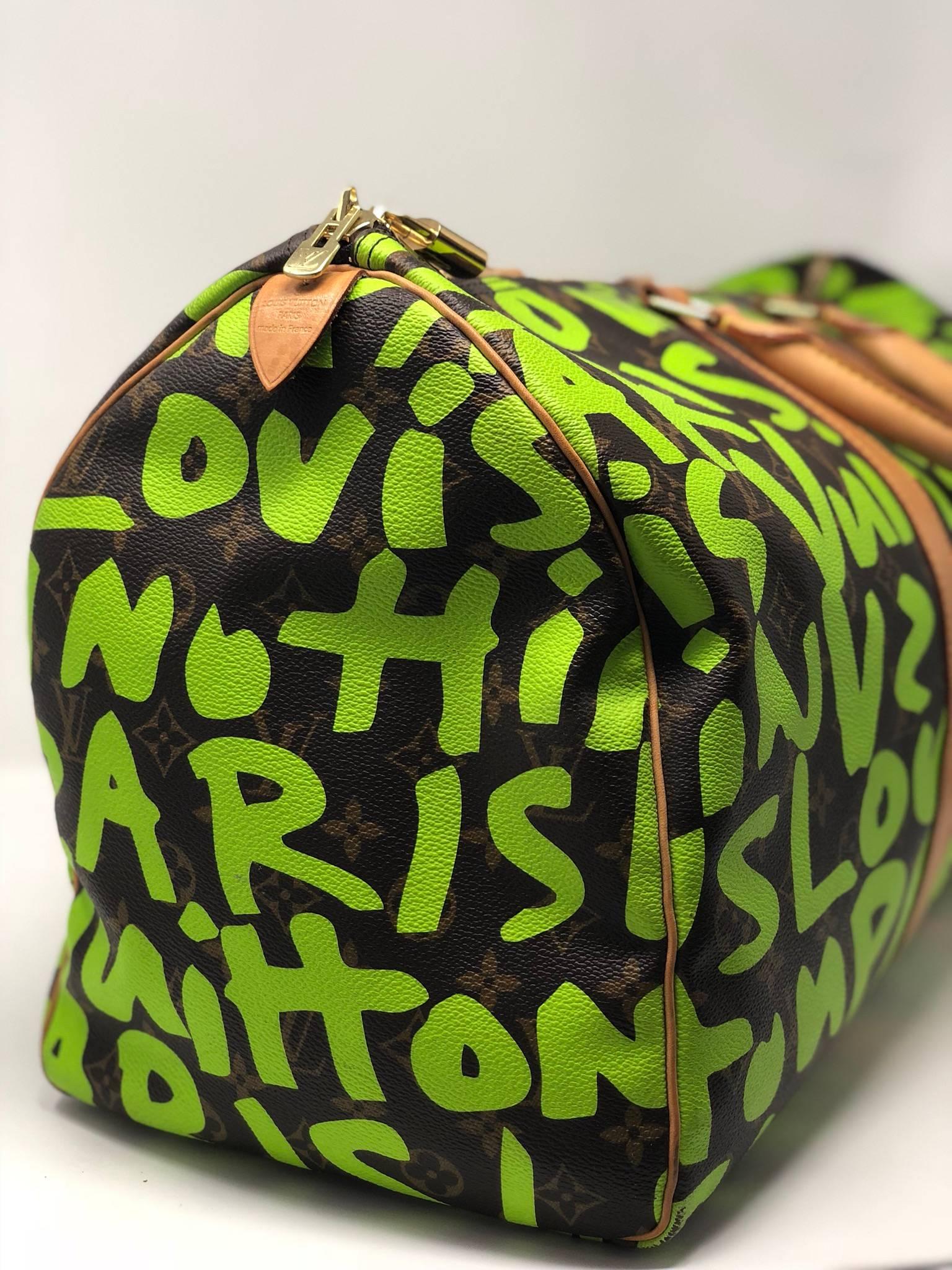 LV Stephen Sprouse Graffiti Keepall 50. Slight wear on the leather and a few water spots. Is the classic LV monogram with green graffiti. Zip closure with gold hardware. 