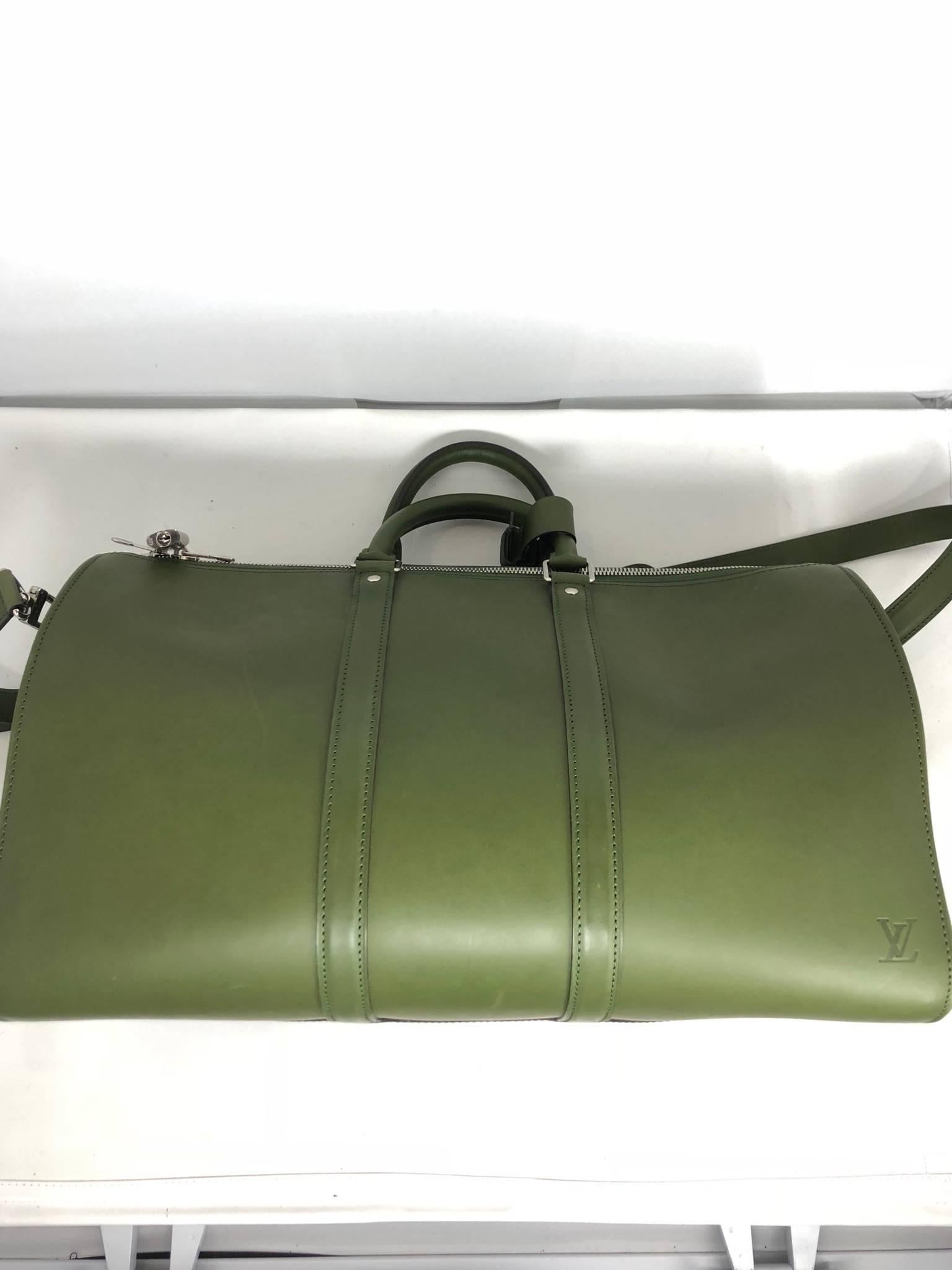Louis Vuitton Nomade leather Keepall 50 Bandouliere in vert green. The special leather is super-smooth and was created back in 1860 by the House. It was re-introduced in the 2012 collection with new colors and shapes. This piece is from the 2012