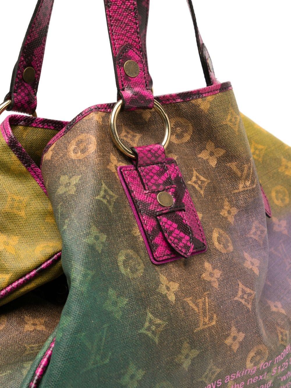 This rare Louis Vuitton Limited Edition Richard Prince Mixed Violet Duderanch Oversized Tote Bag from the 2008 runway collection is sure to turn heads. Crafted of acid colored Monogram canvas and featuring exotic trim, the bag features a signature