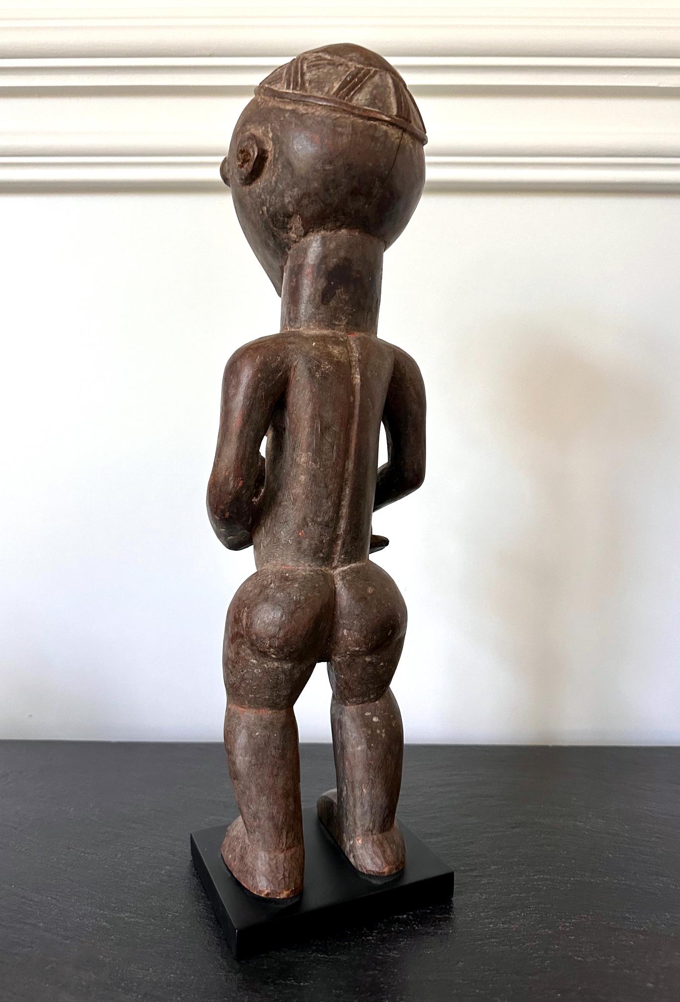 Hand-Carved Lwalwa Mother Figure Holding Baby DR Congo Africa with Provenance For Sale