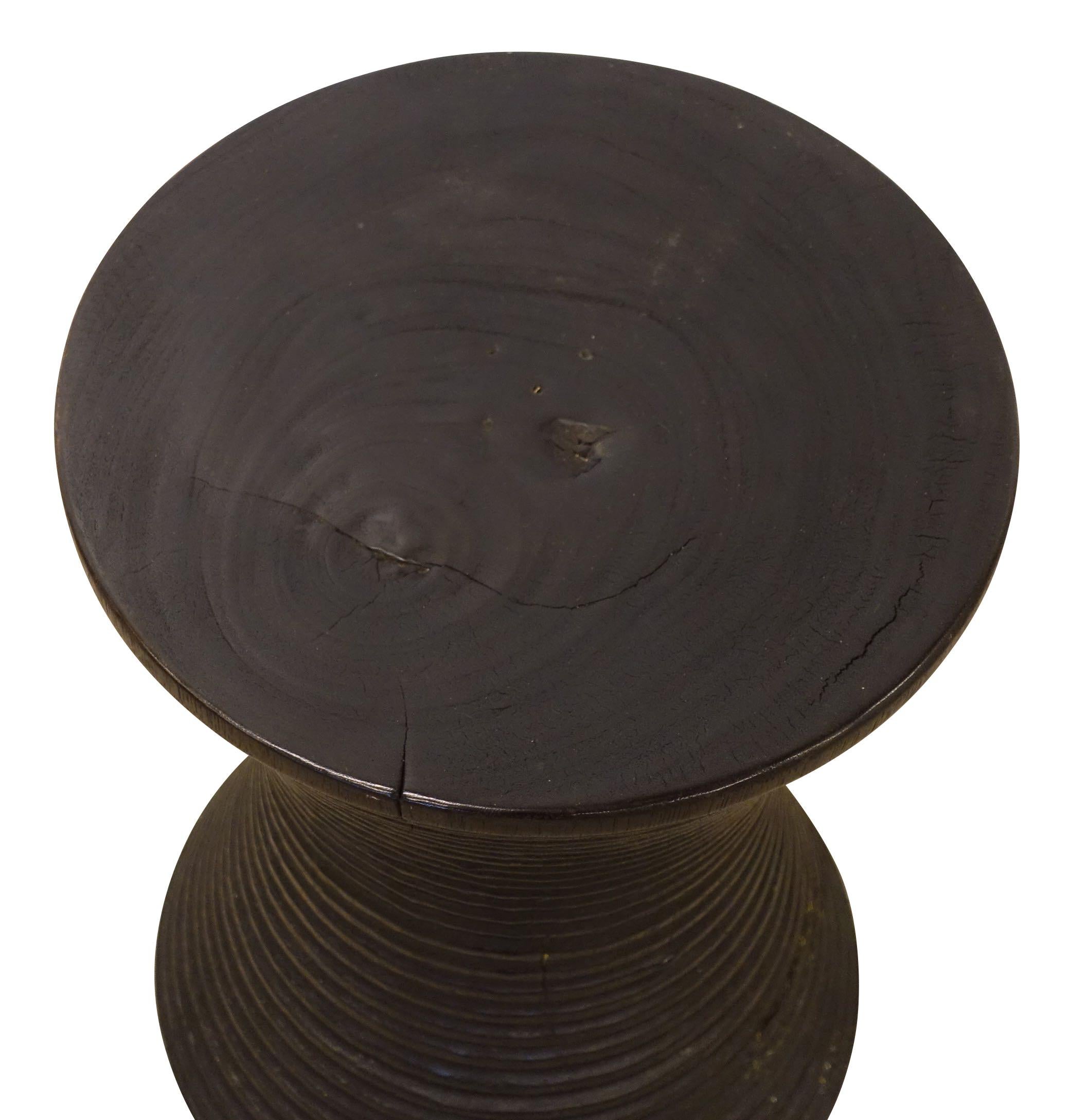 Contemporary Indonesian lychee wood side table
Hour glass shape
Decorative horizontal rib carved lychee wood base.
 