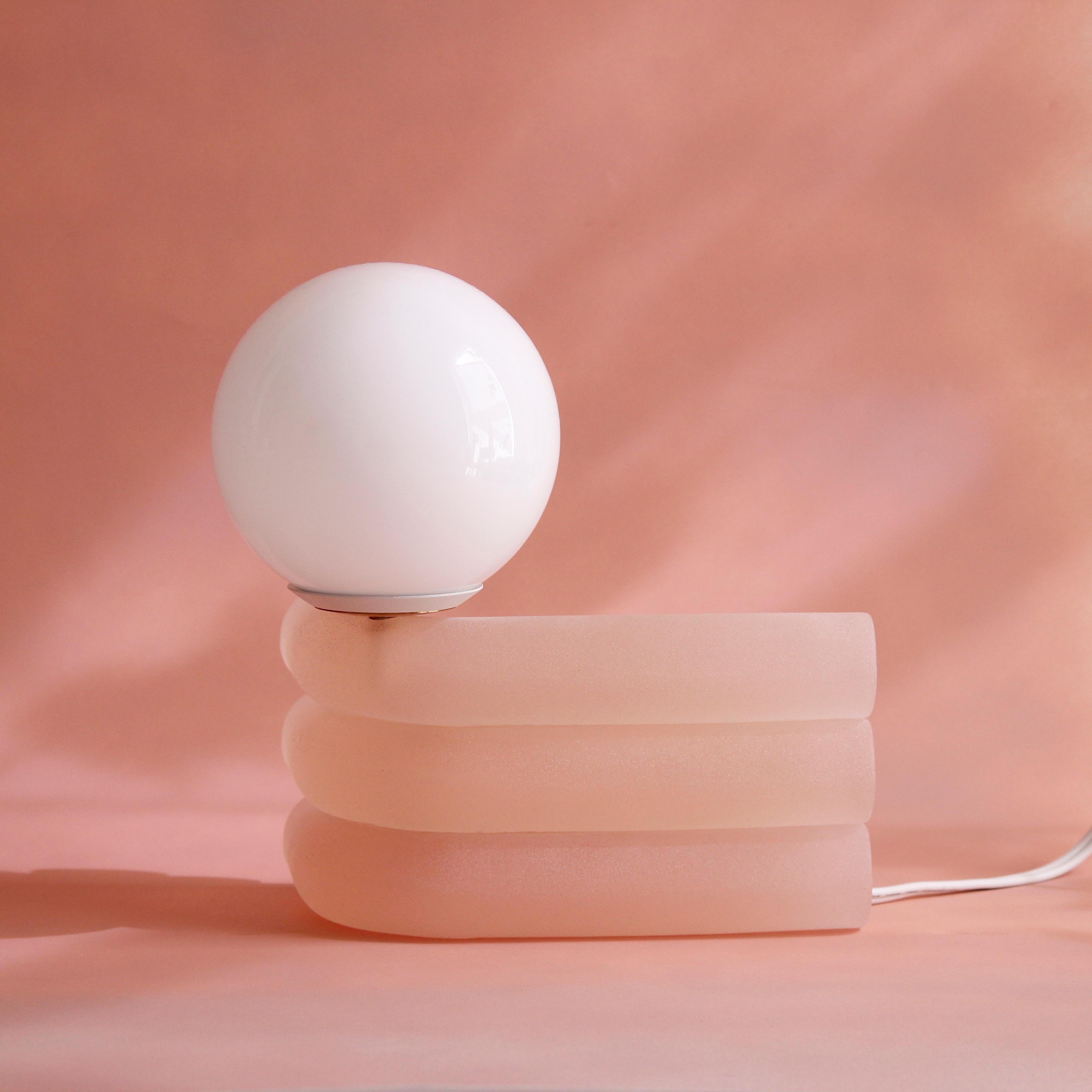 Lychee small Elio lamp by Soft-geometry
Materials: Voice-controlled smart lamp, hand-cast in textured resin
Dimensions: 11” x 7” x 9” H
Voice-controlled smart lamp

Inspired by an informal photo series documenting the play of light on glass,