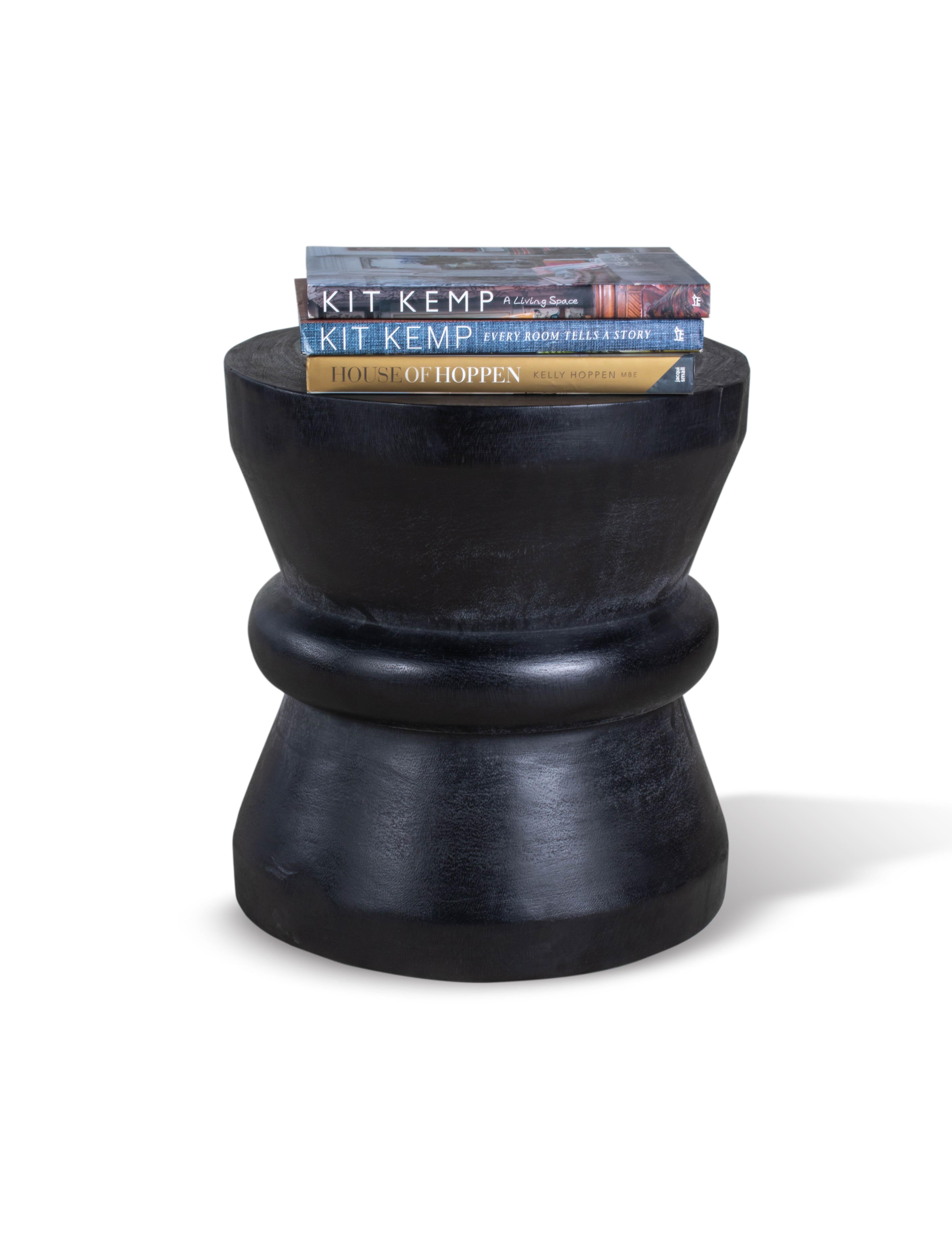 This beautifully crafted piece will be a perfect addition to in any room with its organic and sleek look. The ebonized Lychee wood provides a warm, timeless appeal, while the tapered design gives it a contemporary edge. This wooden side table is a