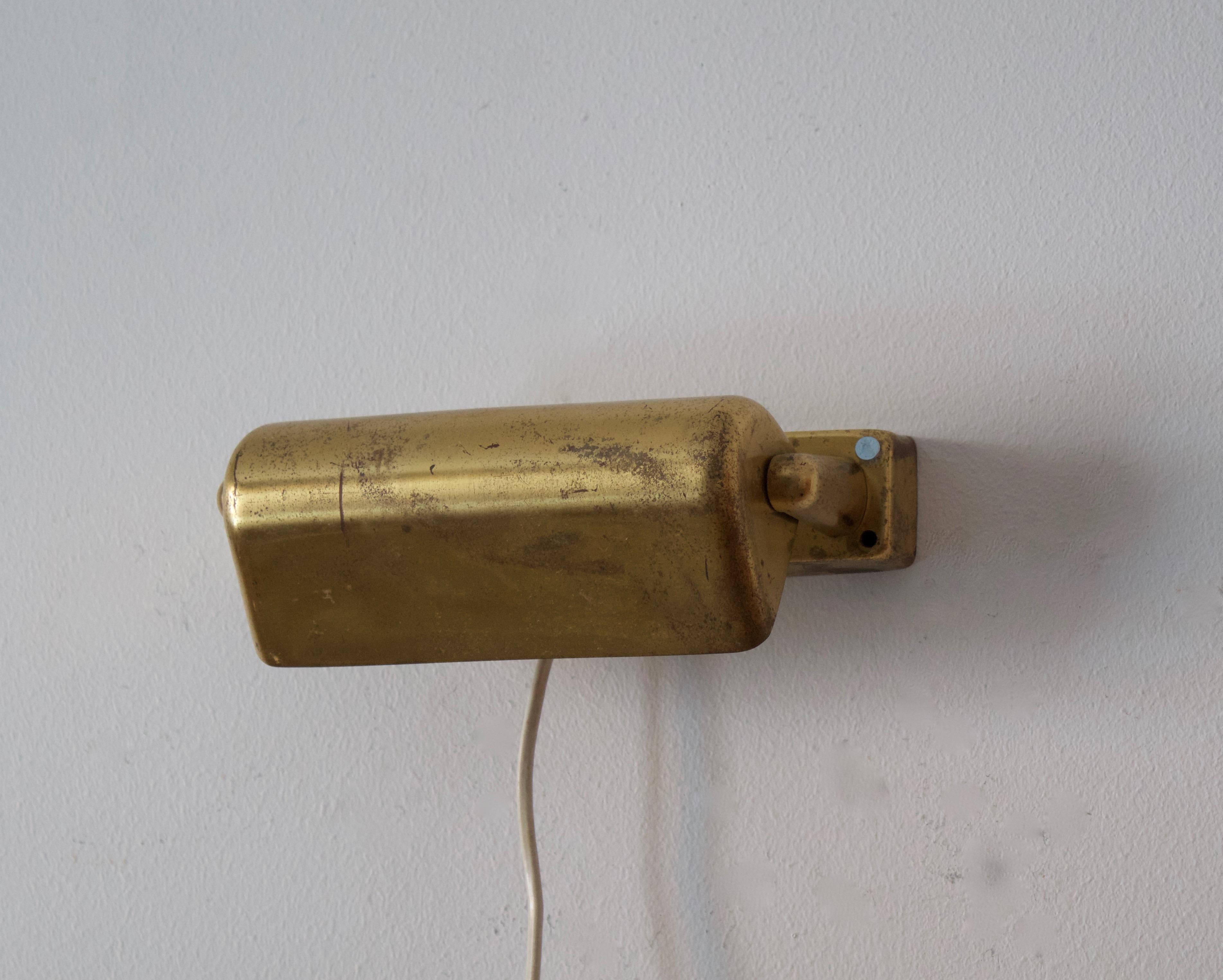 A small adjustable functionalist wall sconce / wall light, designed and produced by Lyfa, Denmark, 1950s. 

Other designers of the period include Paavo Tynell, Le Corbusier, Josef Frank, Kaare Klint, and Alvar Aalto.