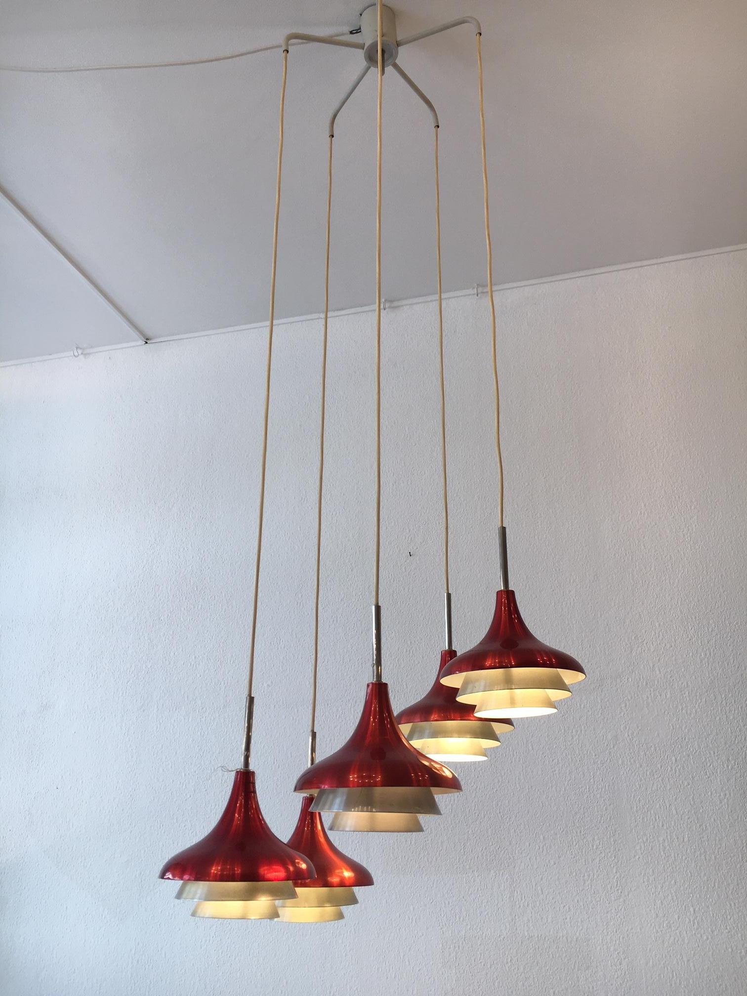 Aluminum and steel pendant lamp by Lyfa Denmark circa 1960s
5 lights, heights of each shade can be adjustable
Good vintage condition
Electrification ok for US.